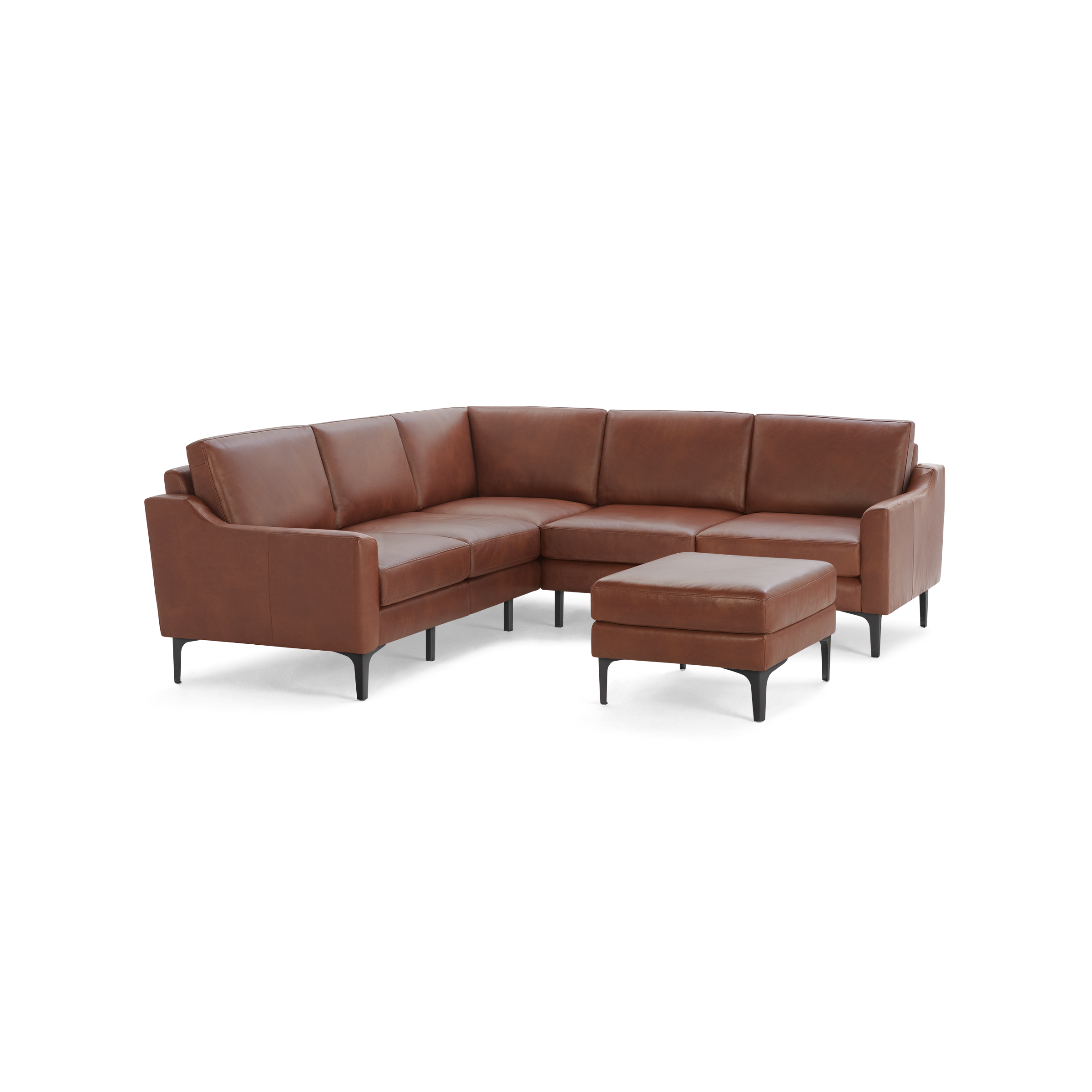 Brown leather L-shaped sectional sofa with matching ottoman, modern design, black legs, cushioned seating and backrests.