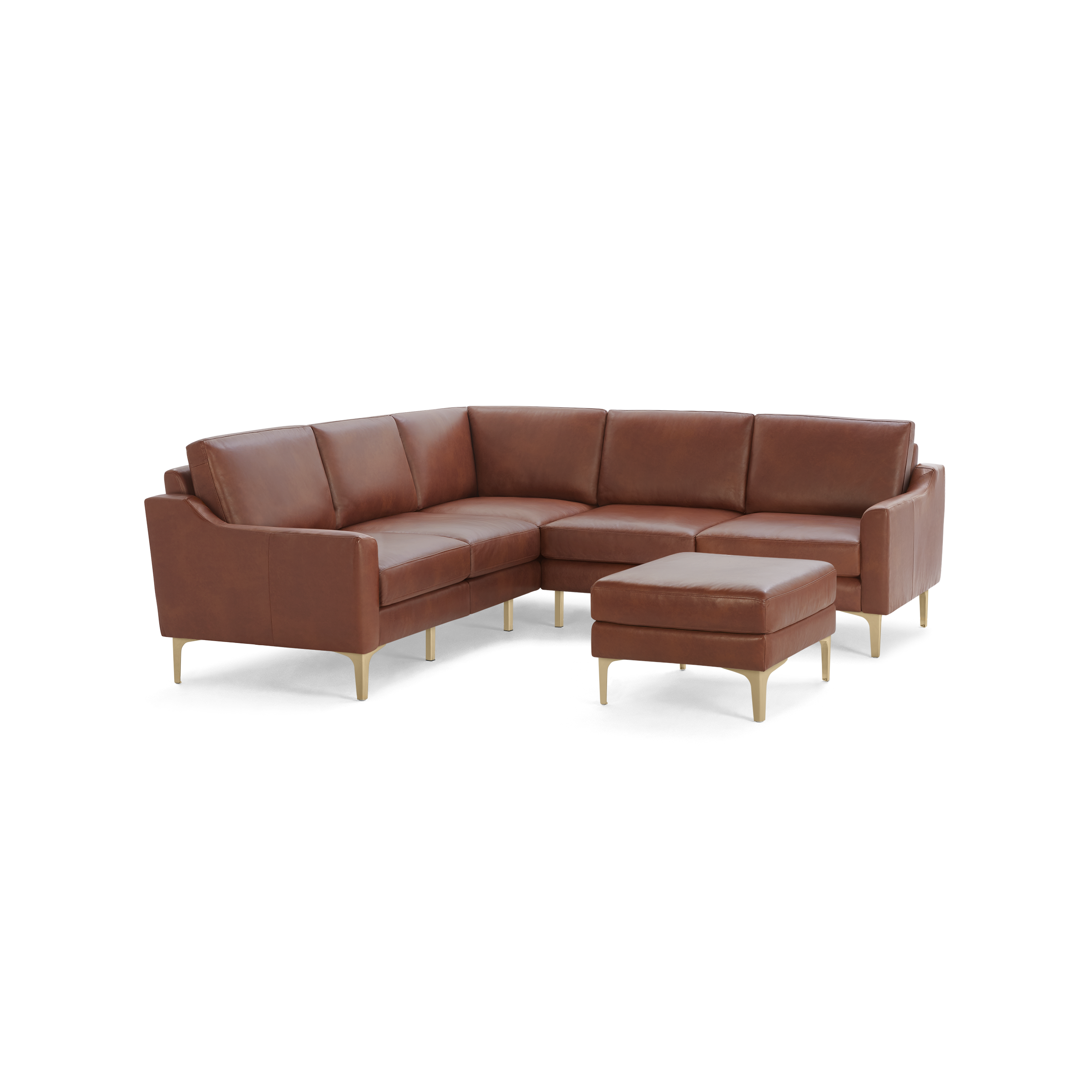 Brown leather L-shaped sectional sofa with matching ottoman, featuring slim armrests and light wooden legs.