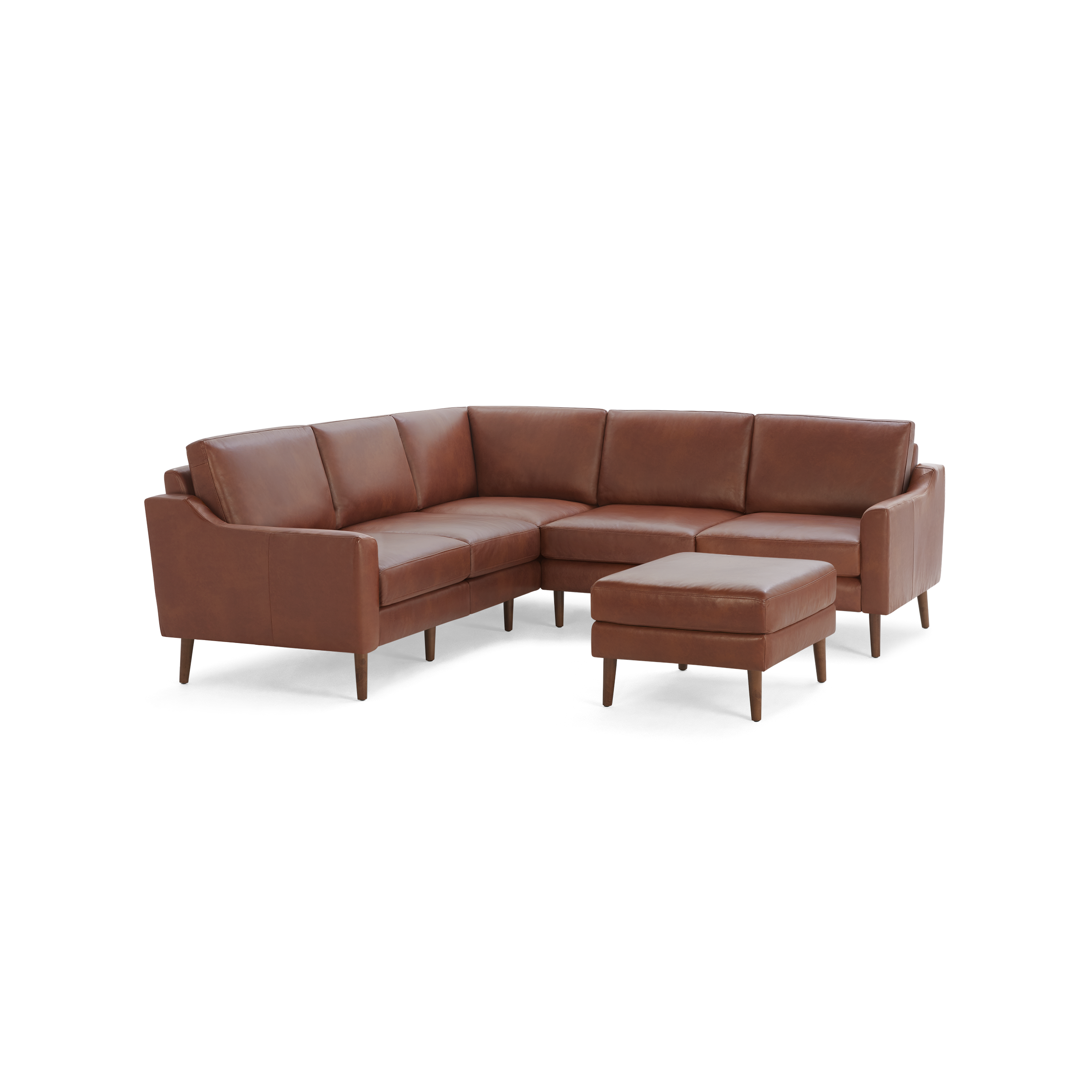 Brown leather L-shaped sectional sofa with cushioned seats and a matching ottoman, supported by tapered wooden legs.