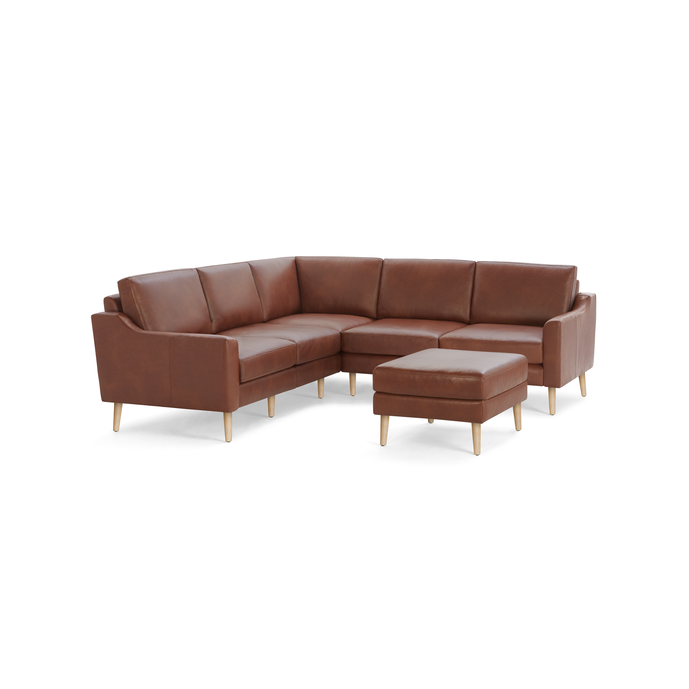 Brown leather L-shaped sectional sofa with wooden legs and a matching ottoman, showcasing modern design and clean lines.