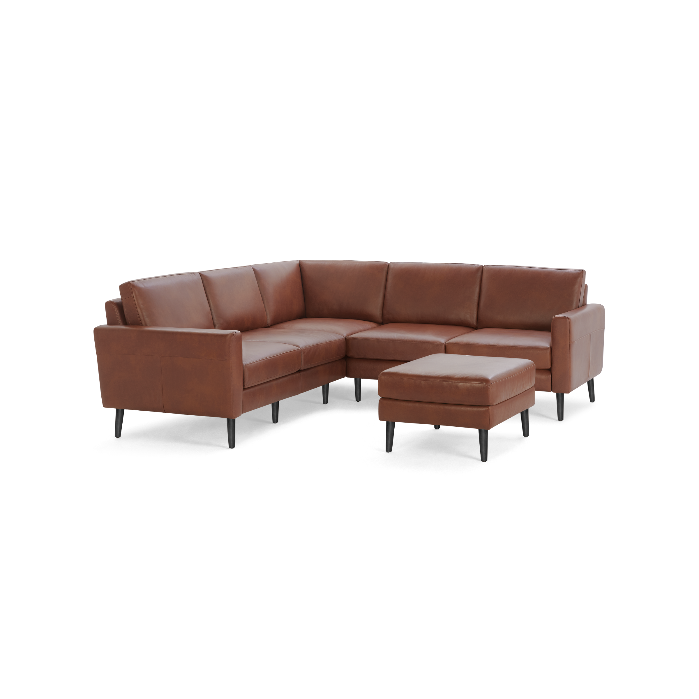 Modern brown leather L-shaped sectional sofa with matching ottoman, supported by slim black wooden legs.