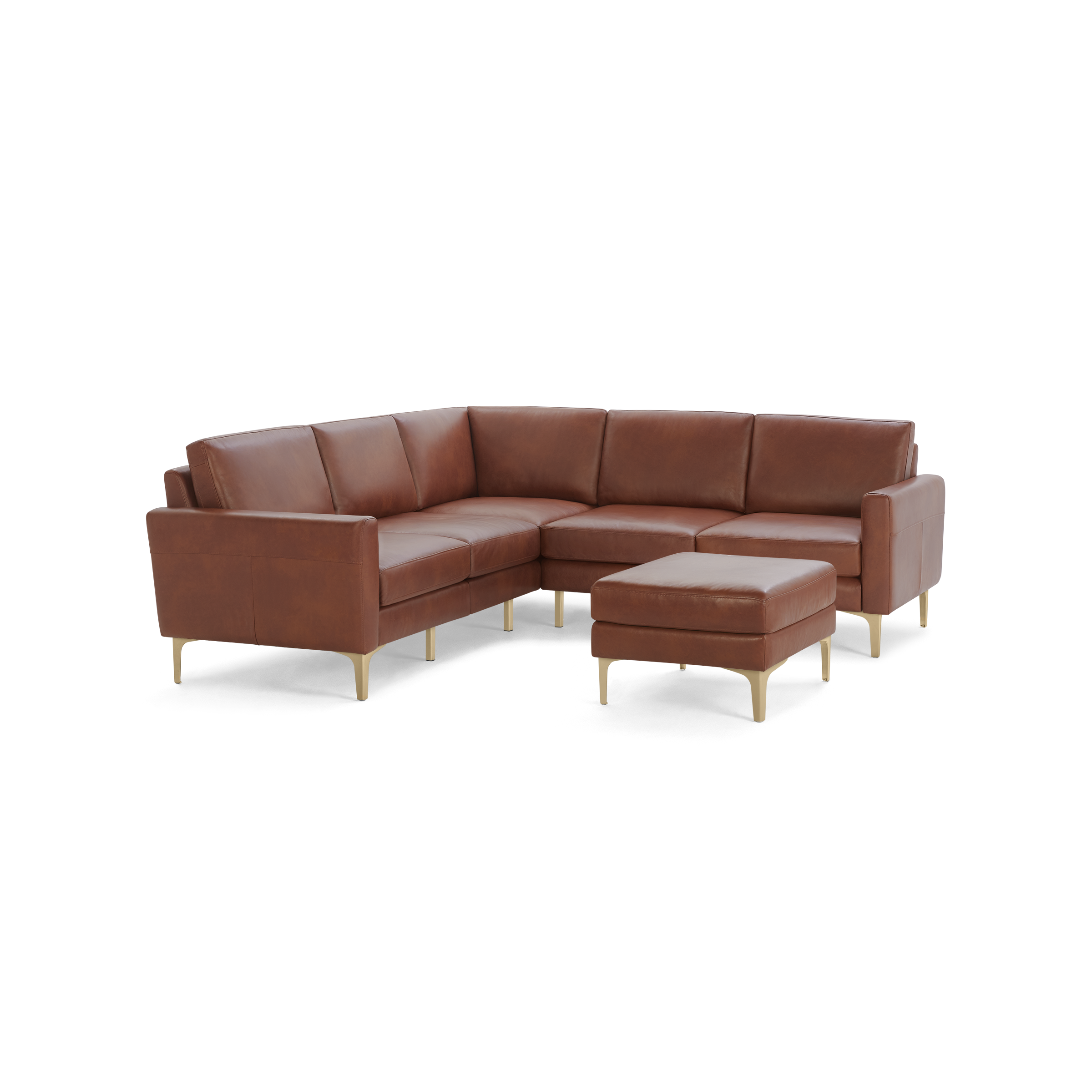 Brown leather L-shaped sectional sofa with matching ottoman, supported by slim tan legs, showcasing modern and minimalist design.