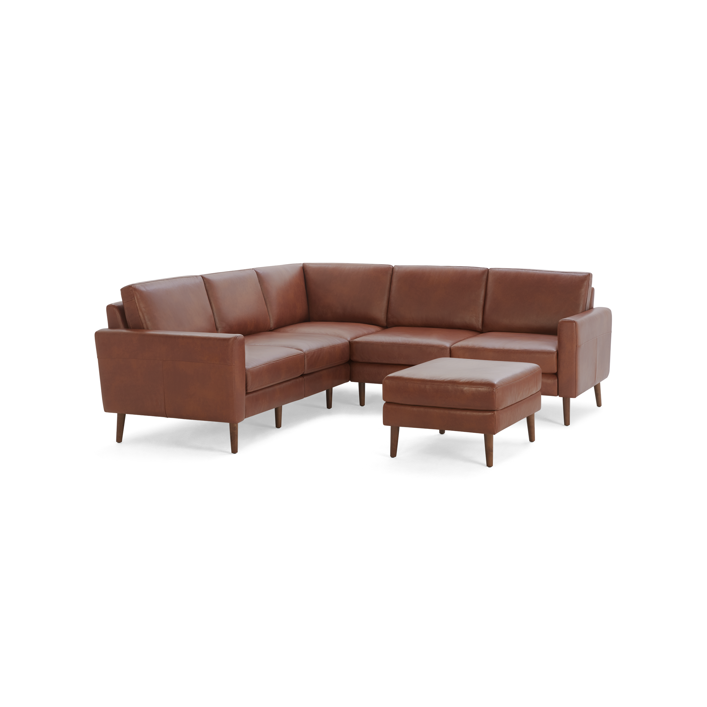 Mid-century modern L-shaped sectional sofa in brown leather with clean lines and matching ottoman, supported by wooden legs.