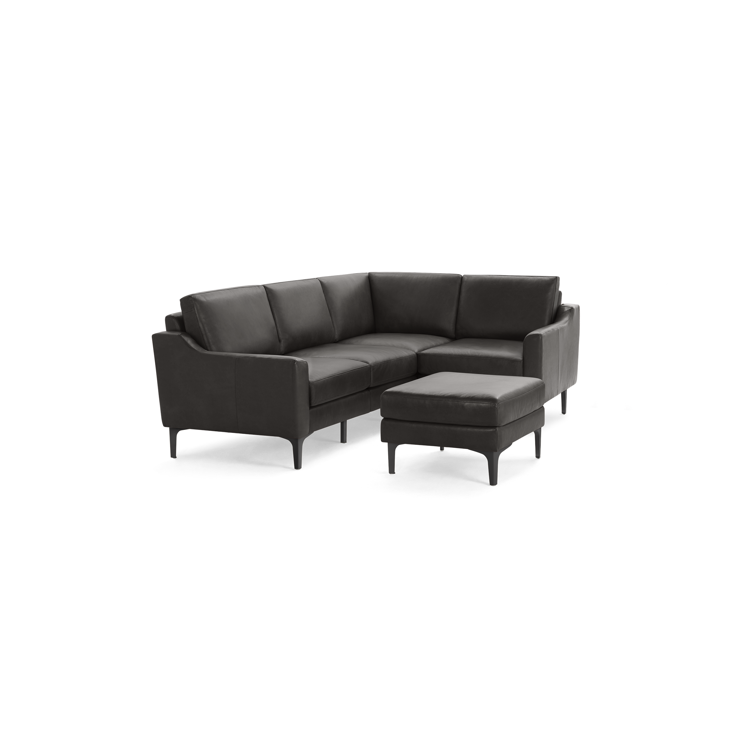 Dark gray modern leather L-shaped sectional sofa with slim armrests and matching ottoman on black metal legs.