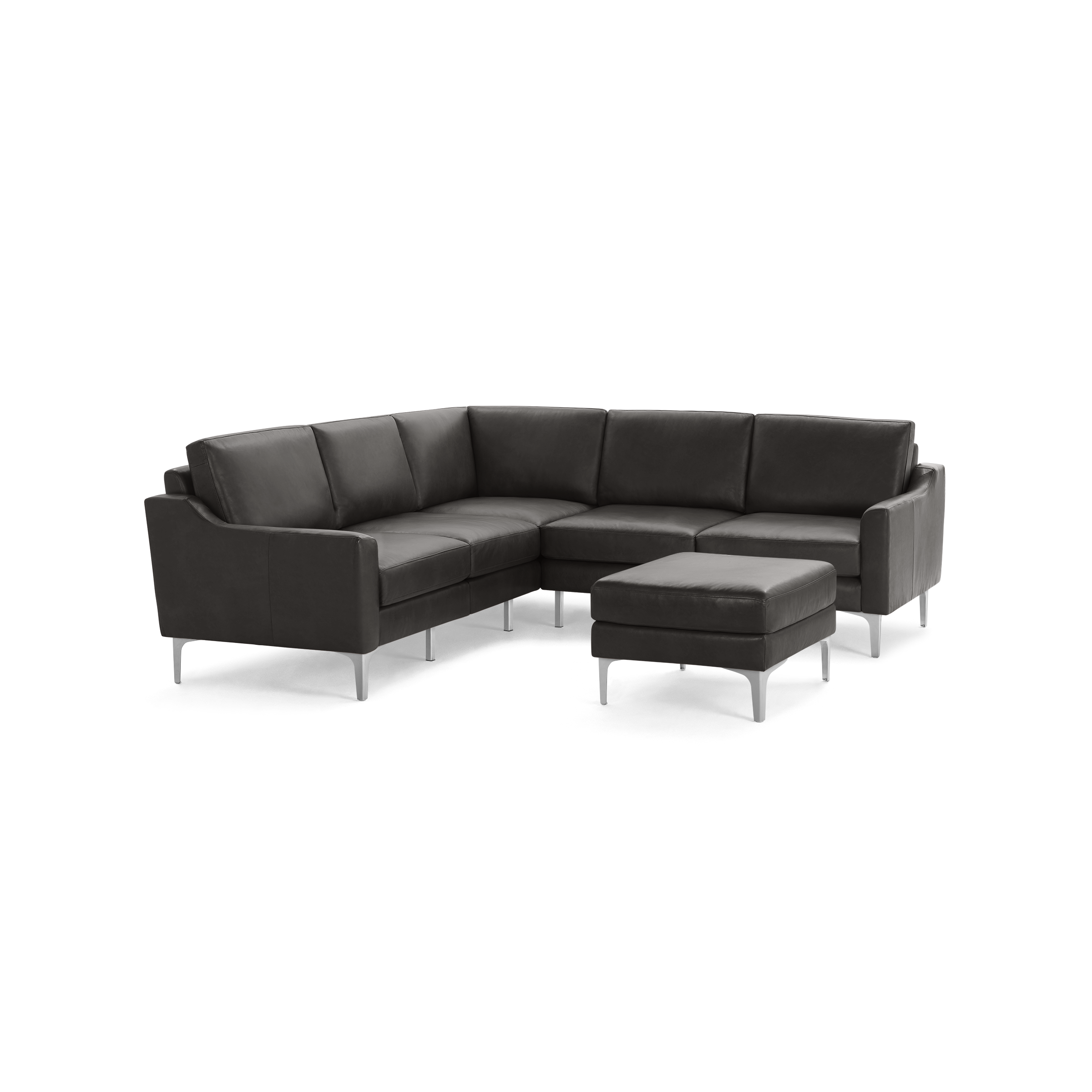 Dark gray L-shaped leather sectional sofa with a matching ottoman and sleek metal legs on a white background.