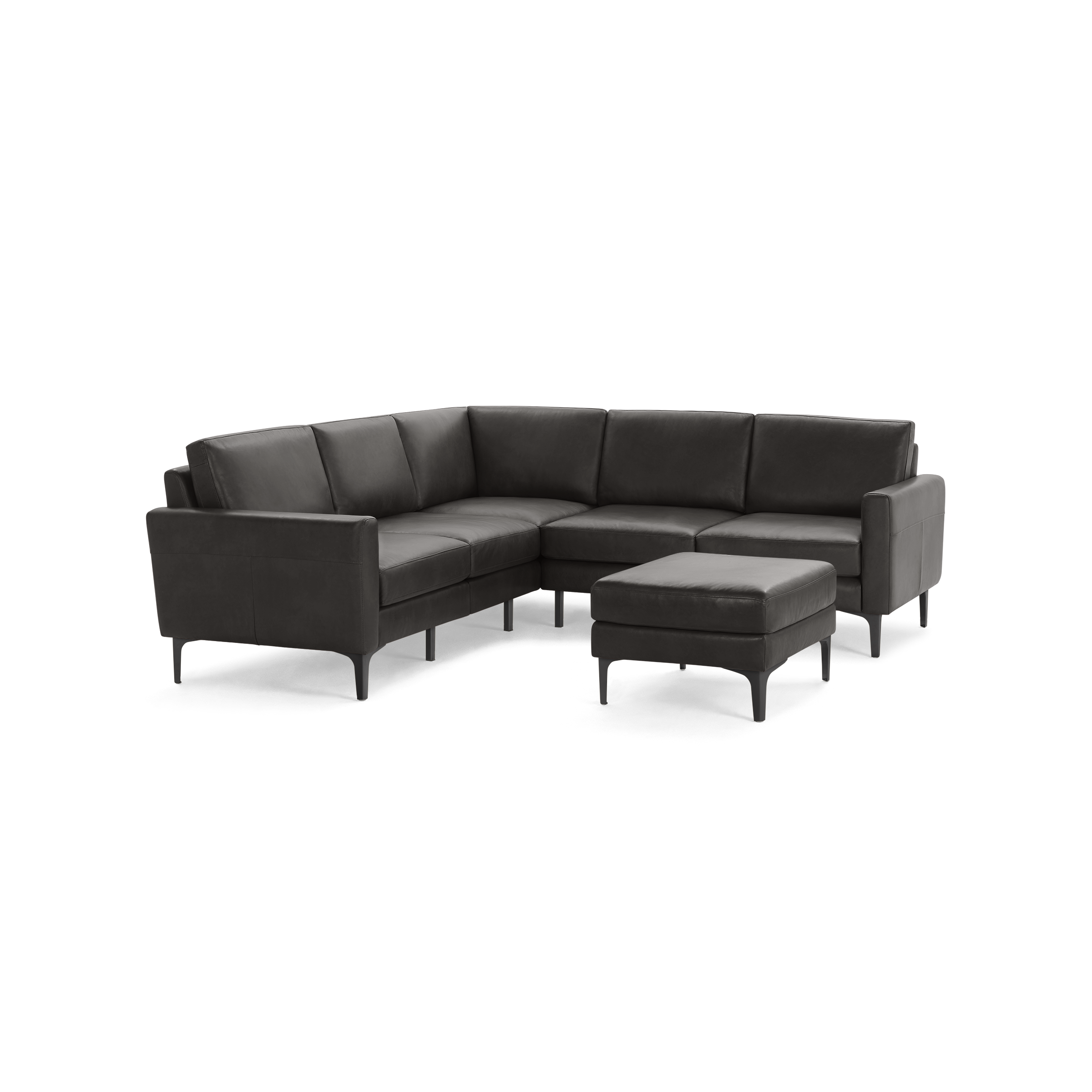 Dark gray leather L-shaped sectional sofa with matching ottoman, supported by slim black metal legs.