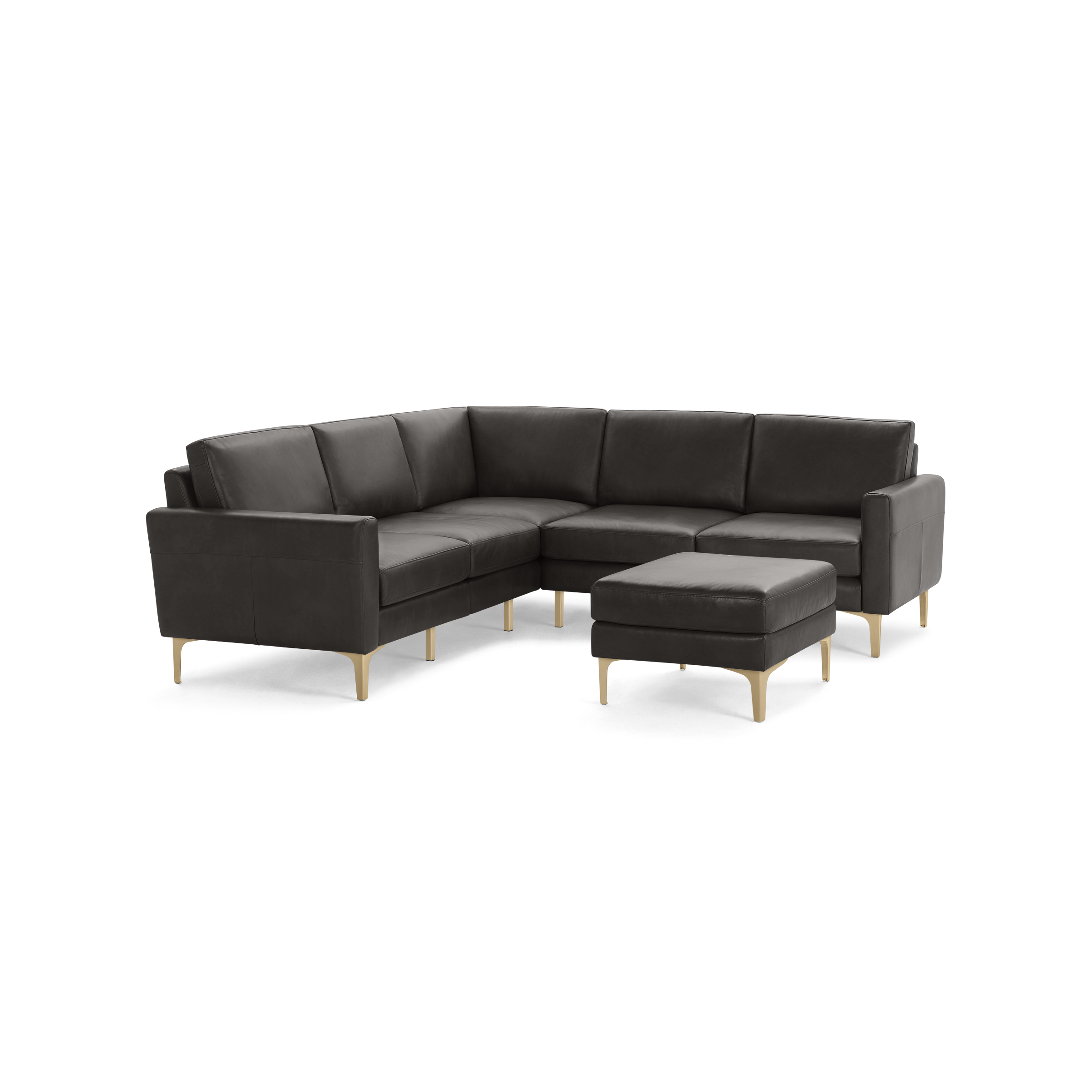Modern L-shaped black leather sectional sofa with matching ottoman, supported by thin gold metal legs.