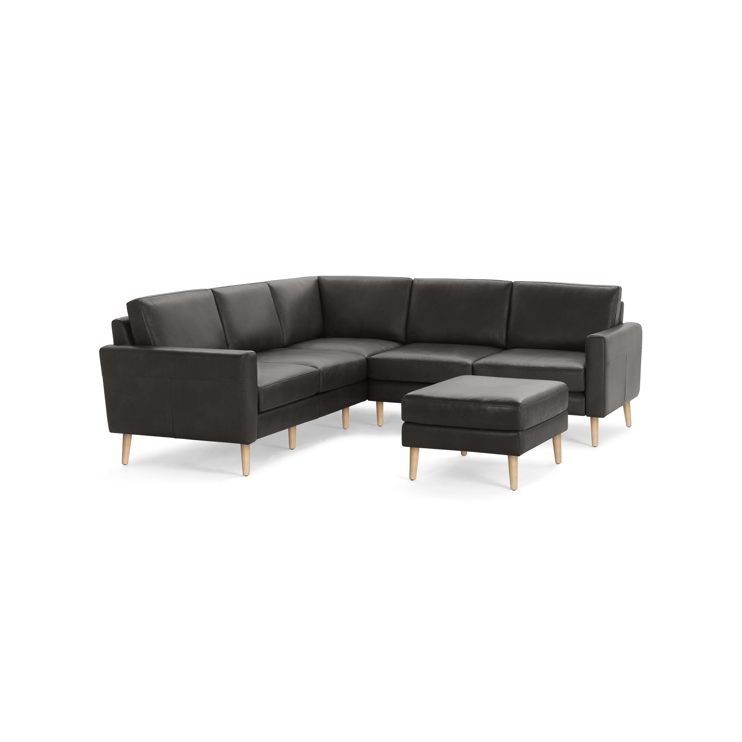 Dark gray L-shaped sectional sofa with wooden legs and matching ottoman, featuring clean modern lines and cushioned seating.
