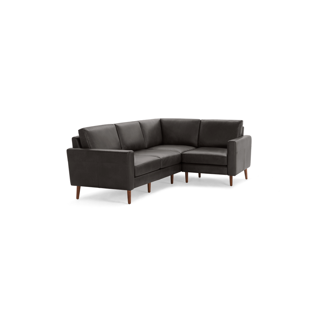 Modern dark gray L-shaped sectional sofa with wooden legs and cushioned seats and backrests.