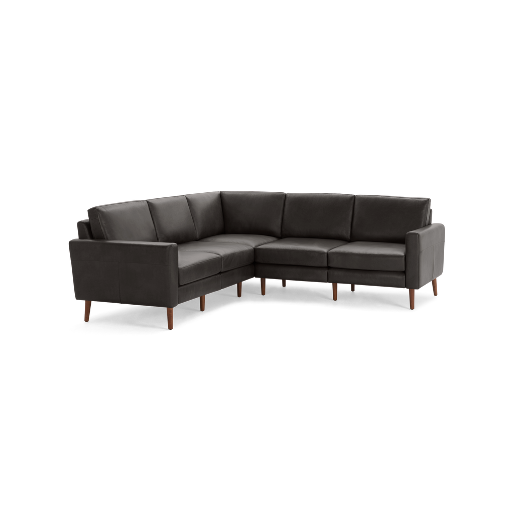 Dark gray L-shaped sectional sofa with wooden legs and clean, modern design, suitable for living rooms.