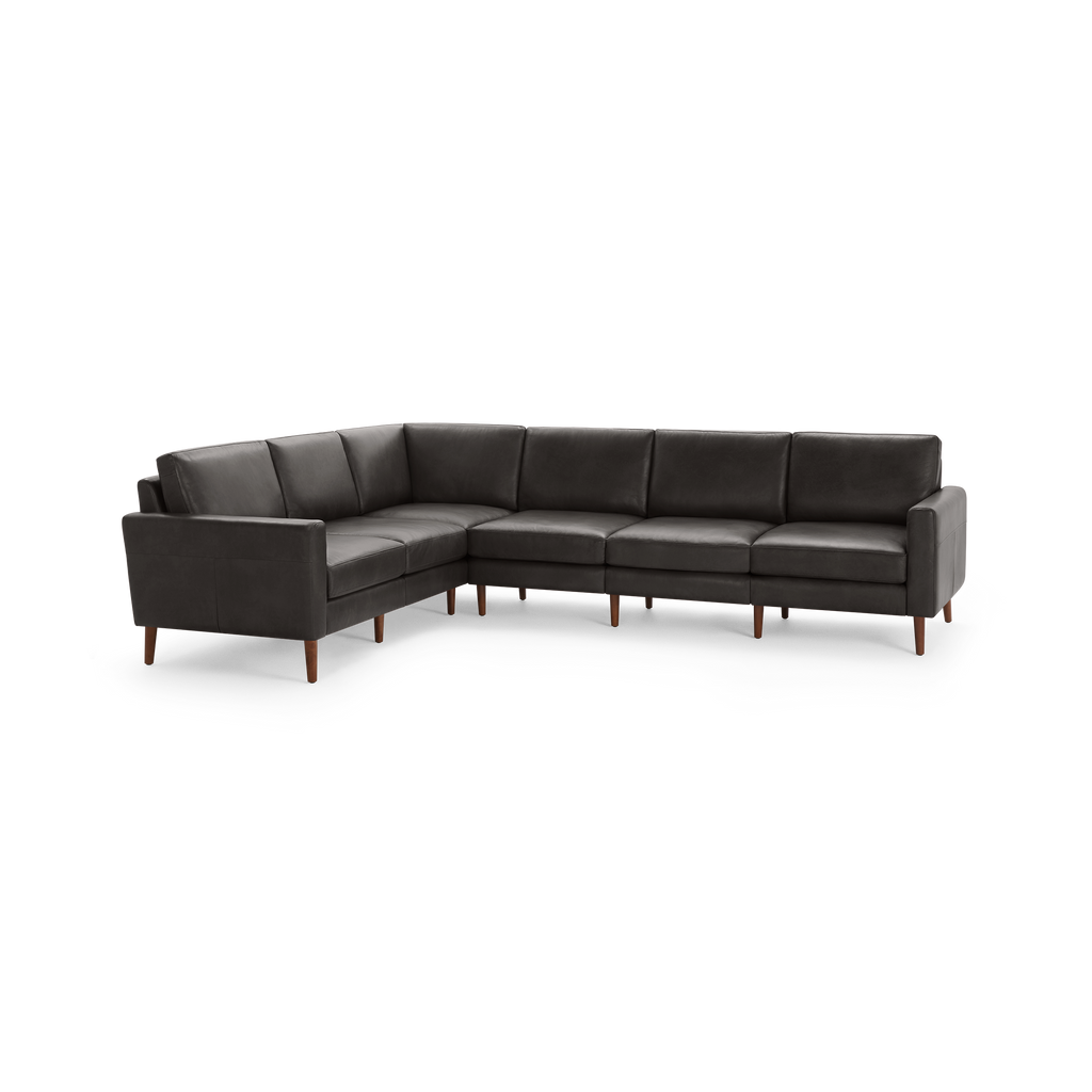 Dark gray leather L-shaped sectional sofa with clean lines, cushioned seats, backs, and wooden legs.