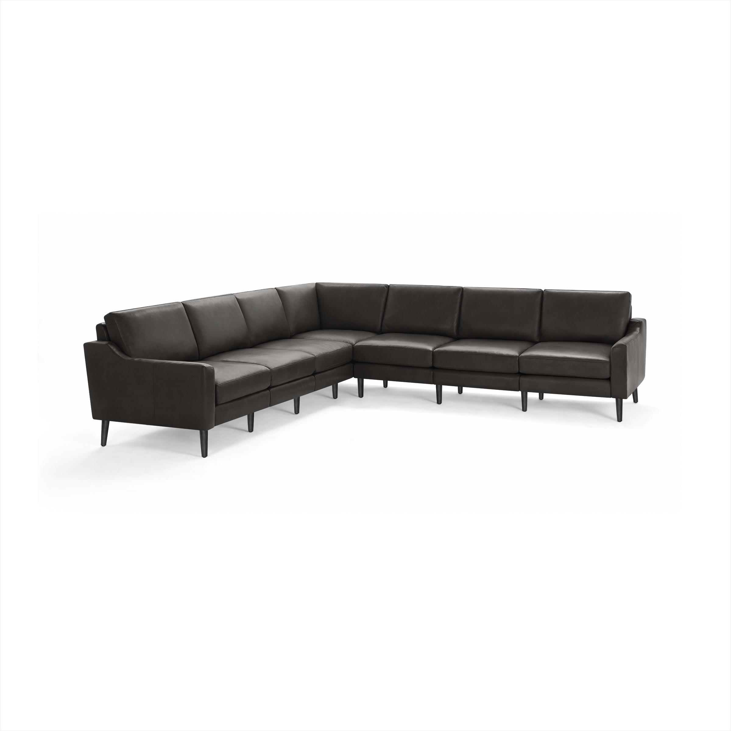 Large dark gray leather sectional sofa with modern design, high back cushions, and slim black legs, arranged in an L-shape.