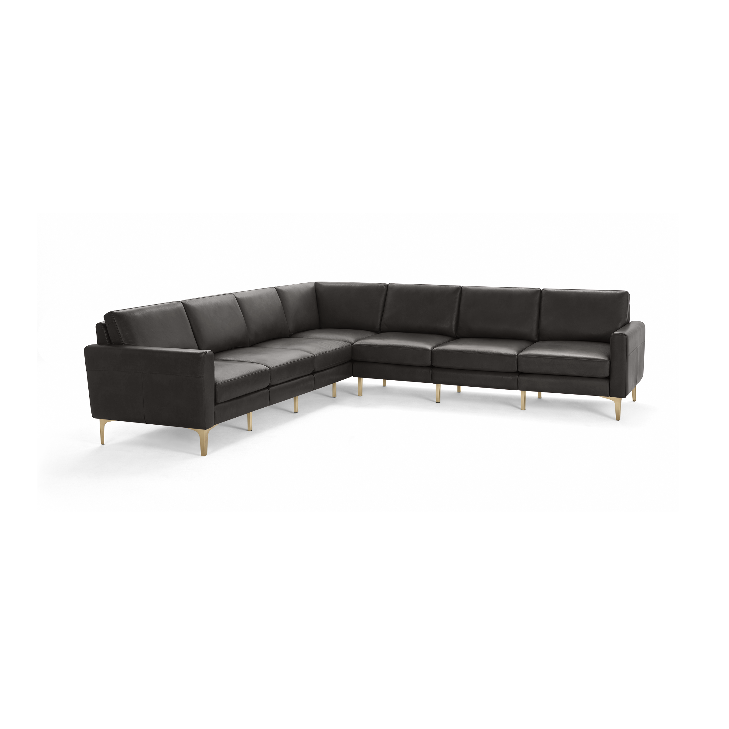 Large modern L-shaped sectional sofa in dark gray leather with slim armrests and light wood legs.
