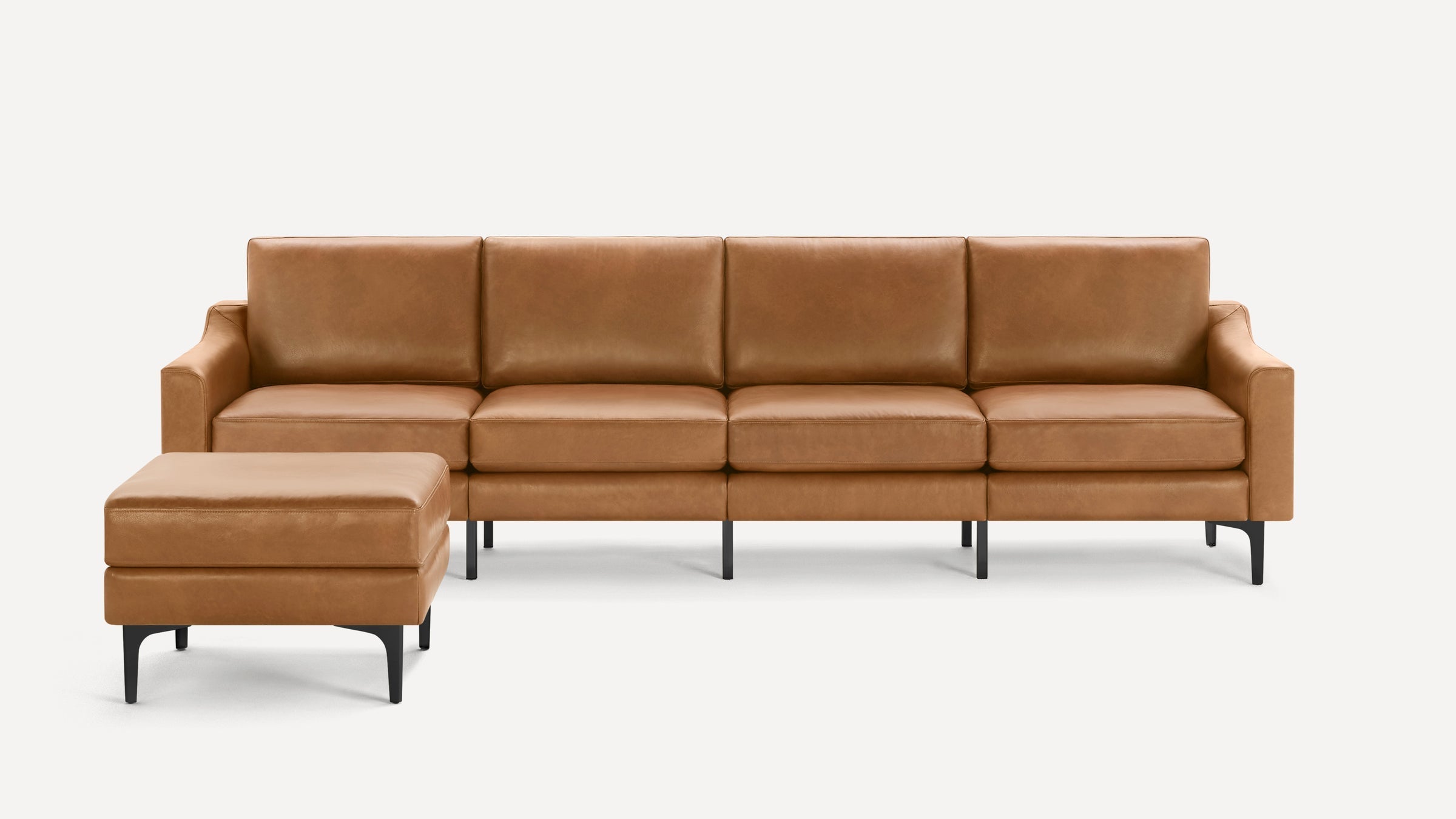 Modern tan leather sectional sofa with clean lines and black metal legs, paired with a matching rectangular ottoman.