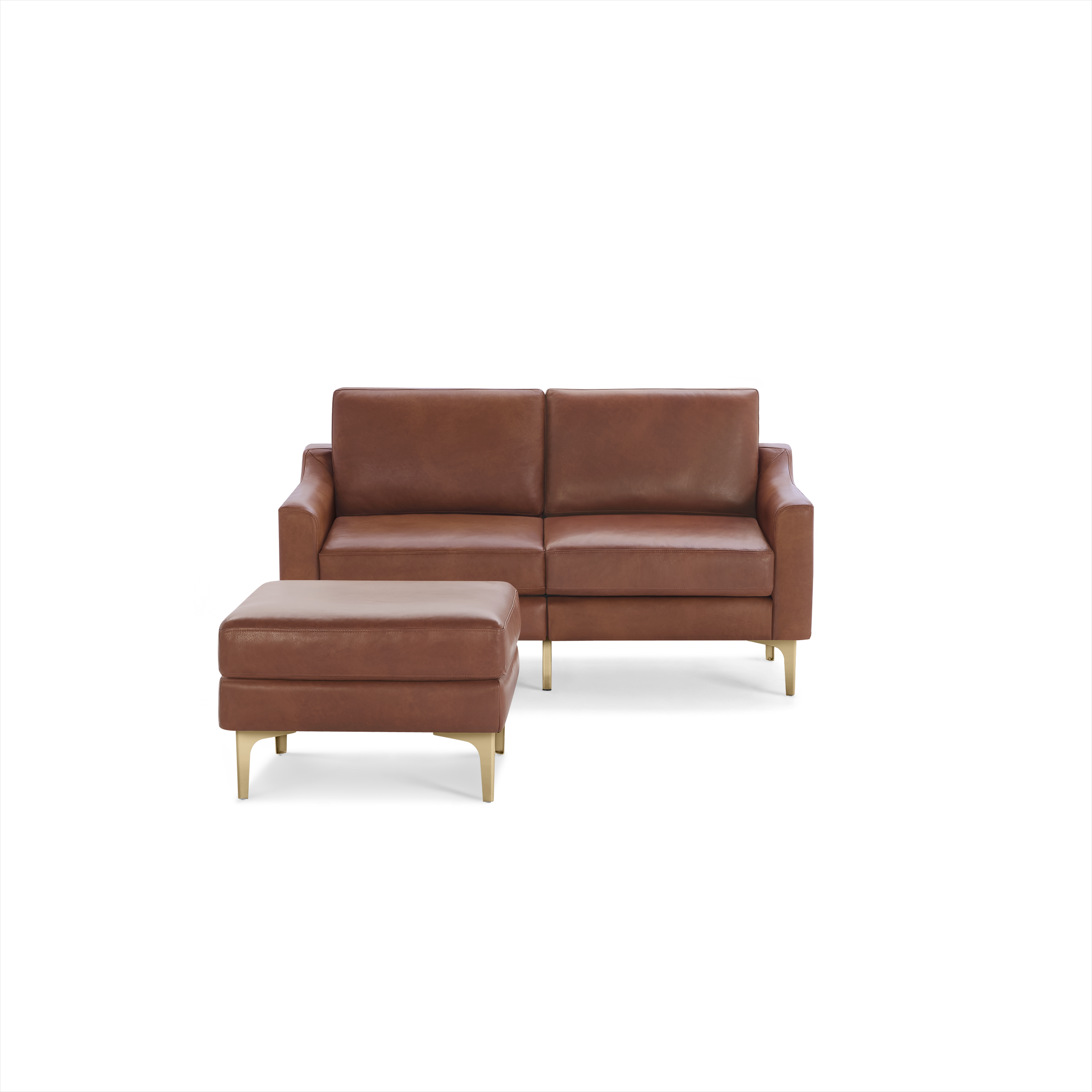 Two-seater brown leather sofa with matching ottoman, featuring slim gold legs and modern, minimalist design.