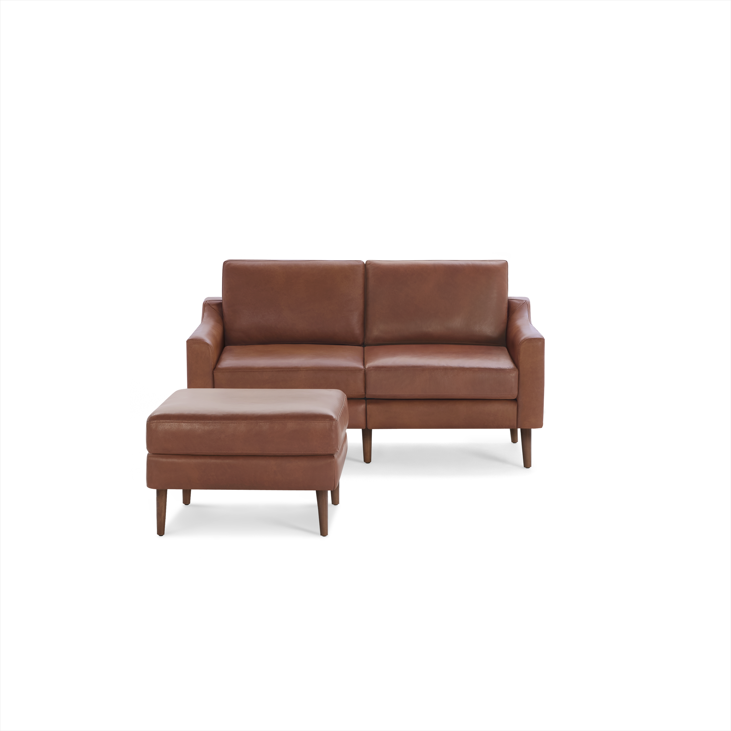 Mid-century modern brown leather loveseat sofa with matching ottoman, featuring wooden legs and clean lines.