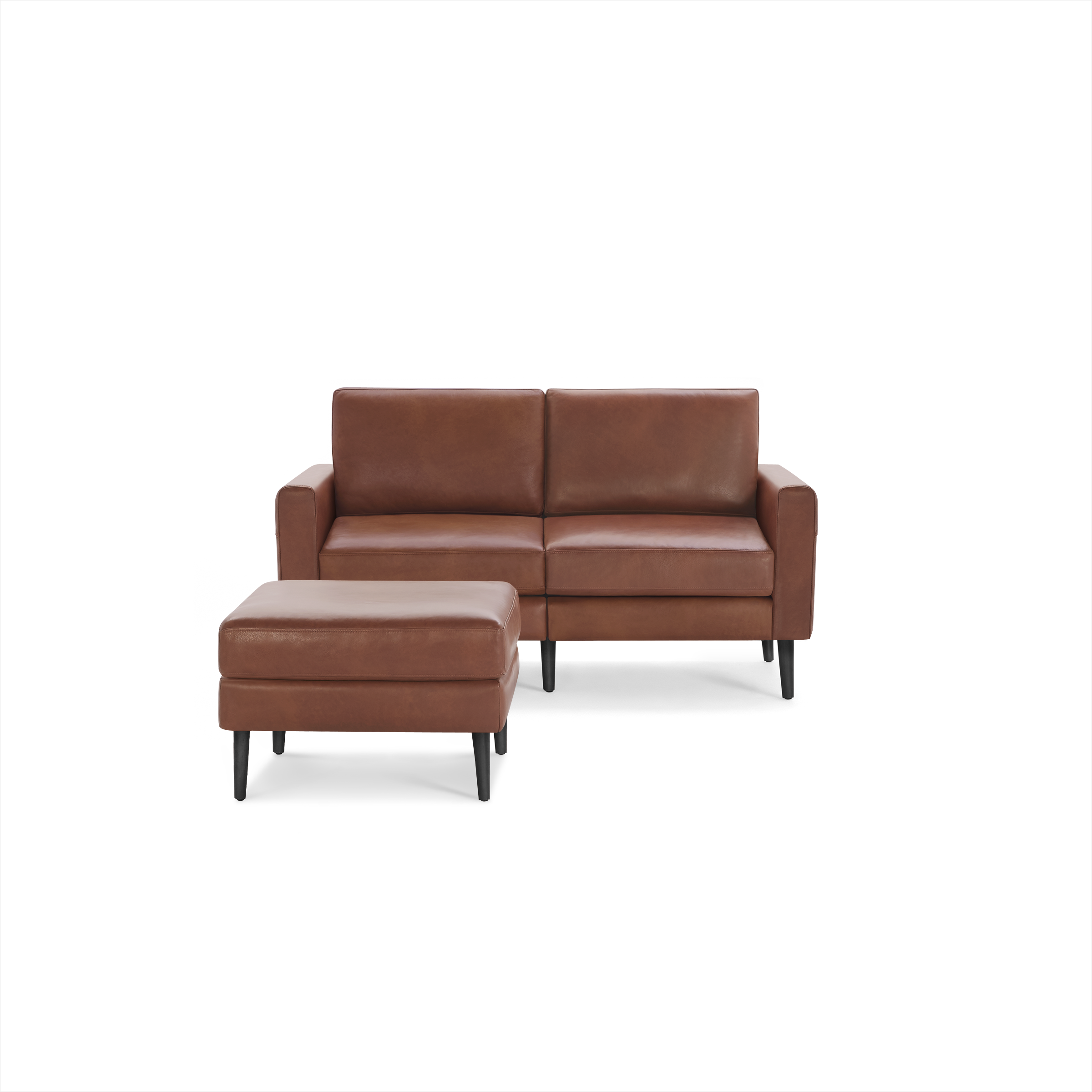 Modern brown leather loveseat sofa with matching cushioned ottoman and black tapered wooden legs.