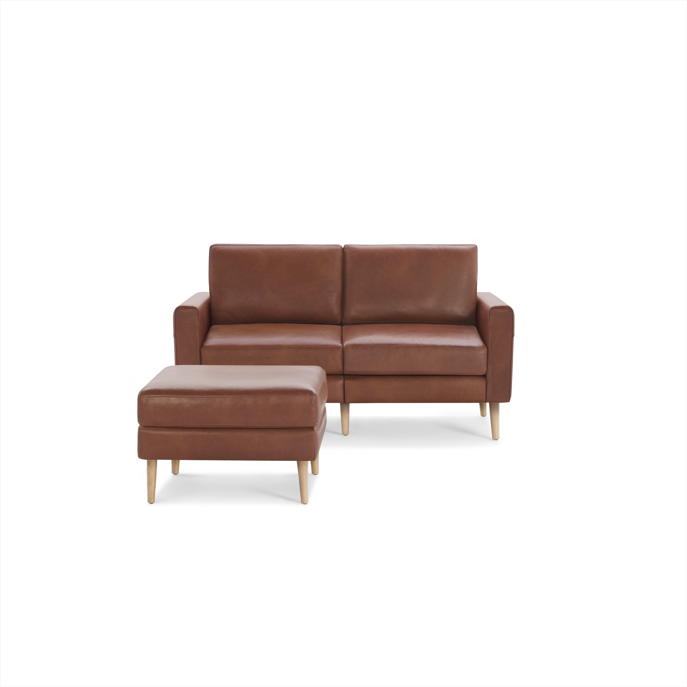 Brown leather two-seater sofa with clean lines and wooden legs, accompanied by a matching cushioned ottoman.