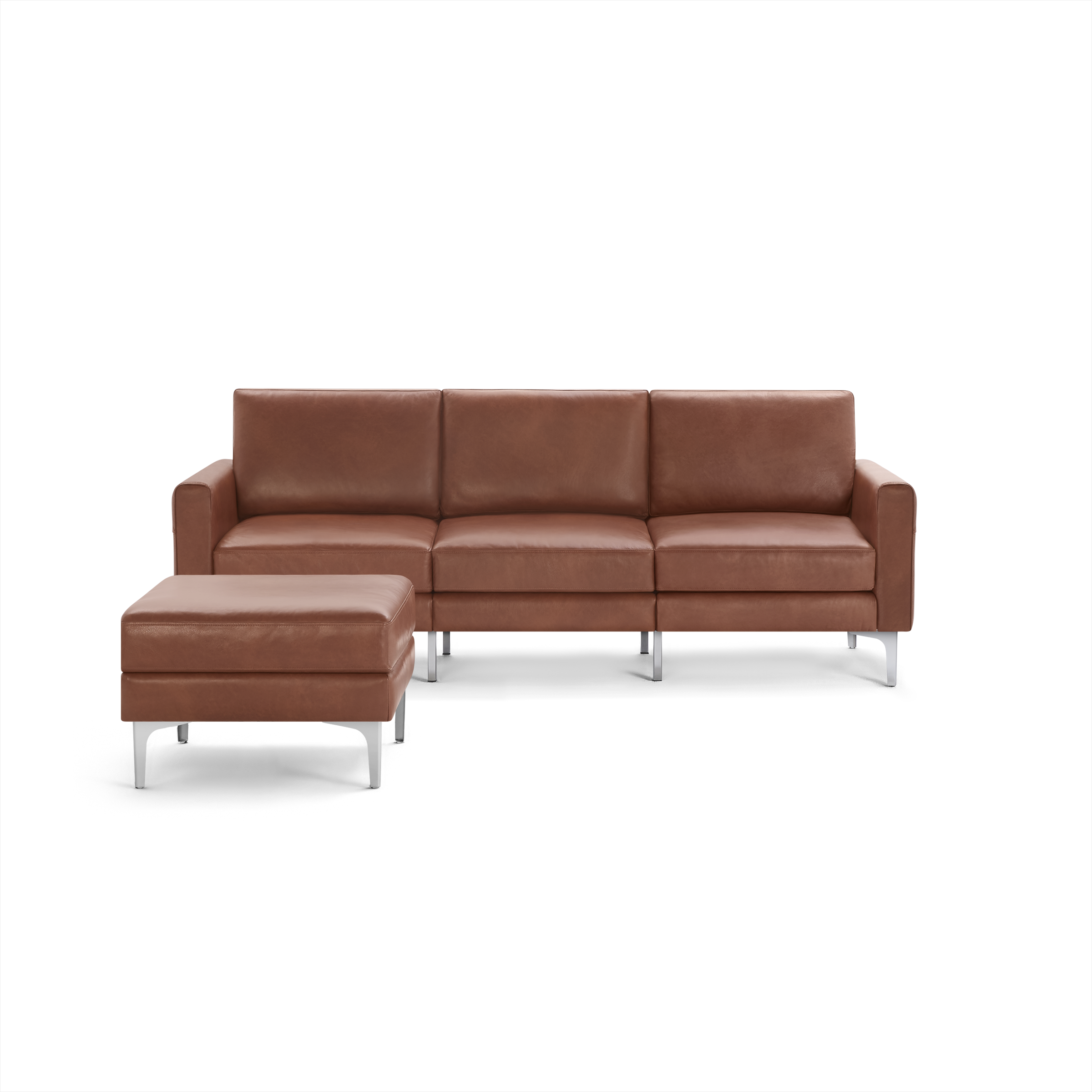 Three-seater brown leather sofa with a matching rectangular ottoman, both supported by sleek metal legs.