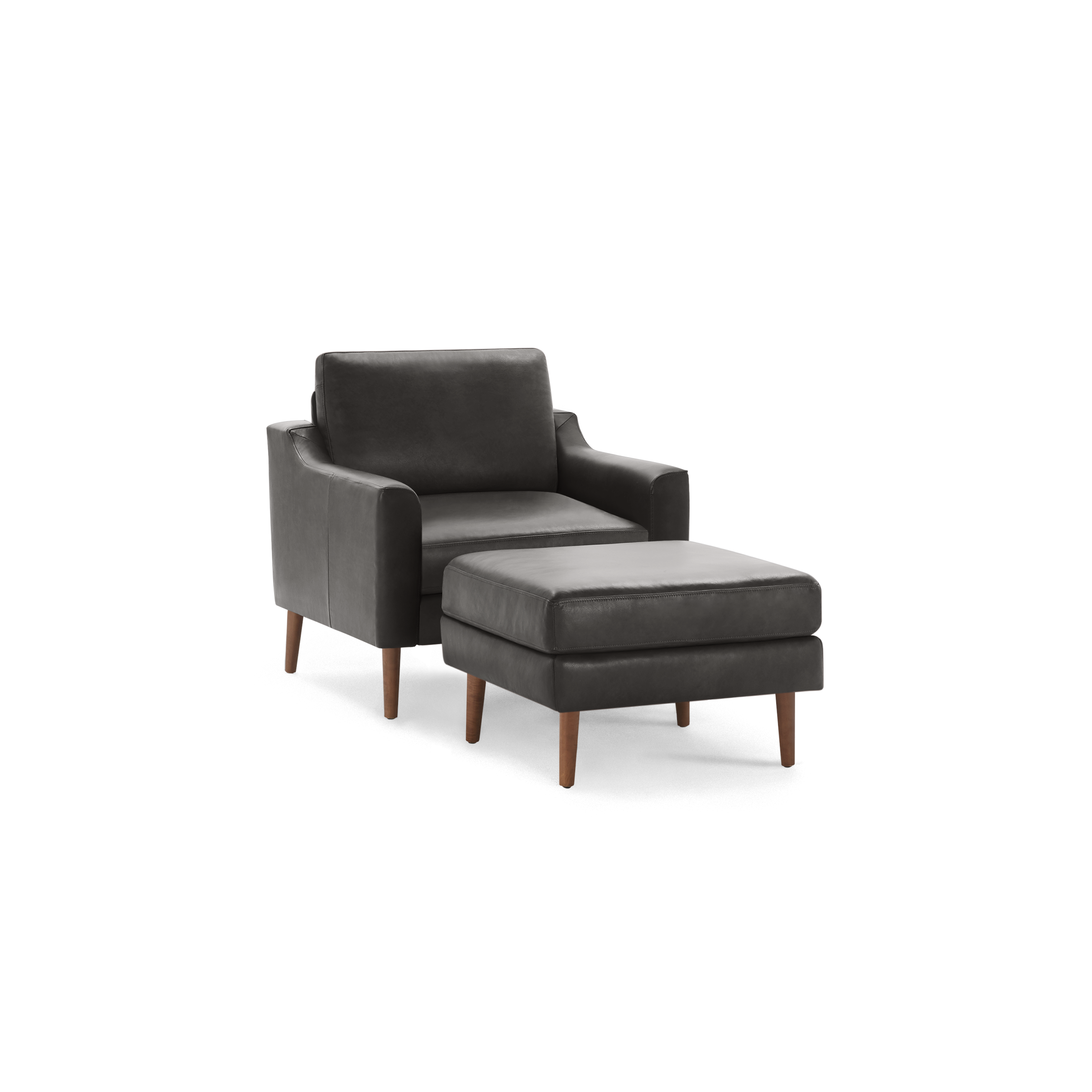 Dark gray leather armchair with matching ottoman, both featuring wooden tapered legs, contemporary design.
