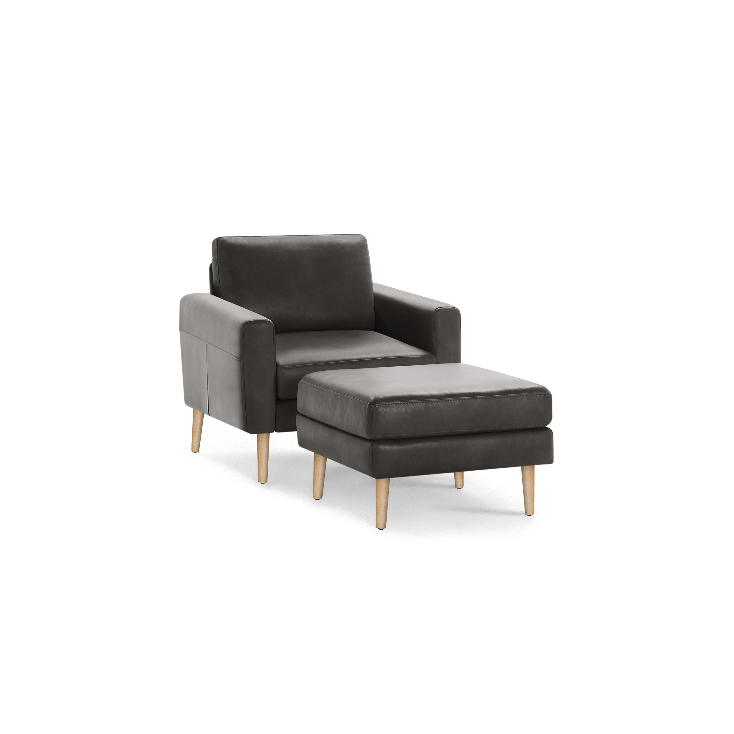 Dark gray leather armchair with matching ottoman, both featuring light wooden legs and modern, clean design.