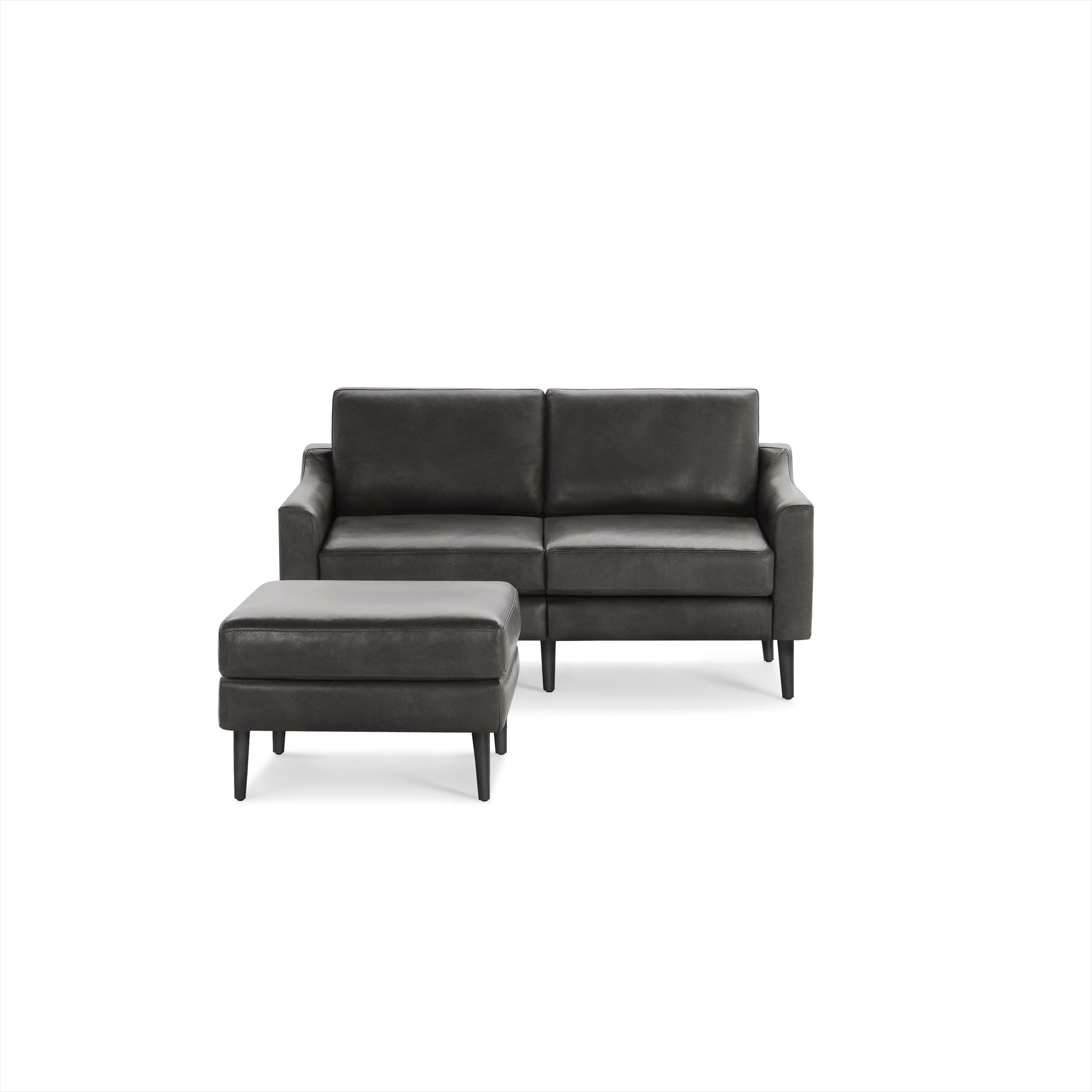 Dark gray modern two-seater sofa with matching ottoman, featuring clean lines and tapered black wooden legs.