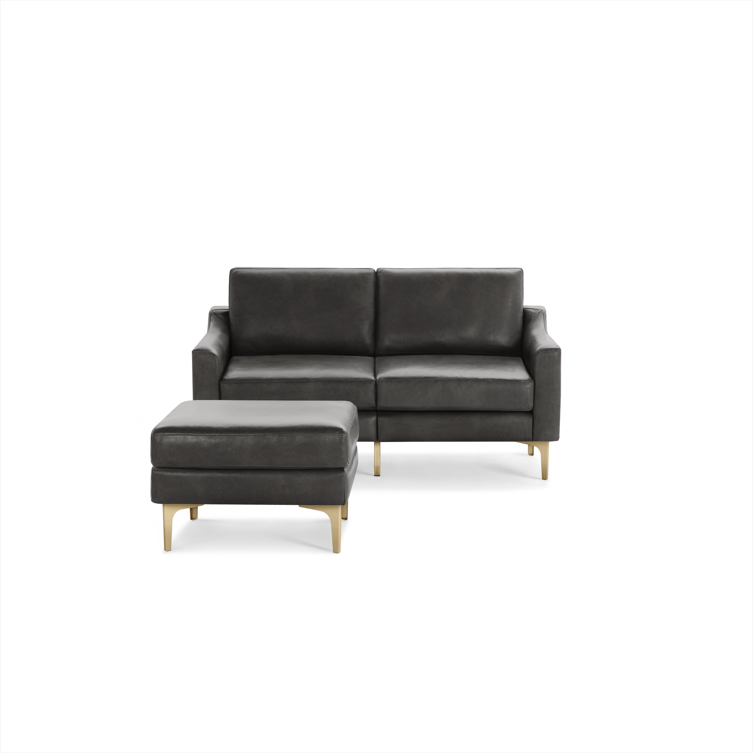 Modern dark gray leather loveseat with matching ottoman, featuring gold metal legs and clean, minimalist design.