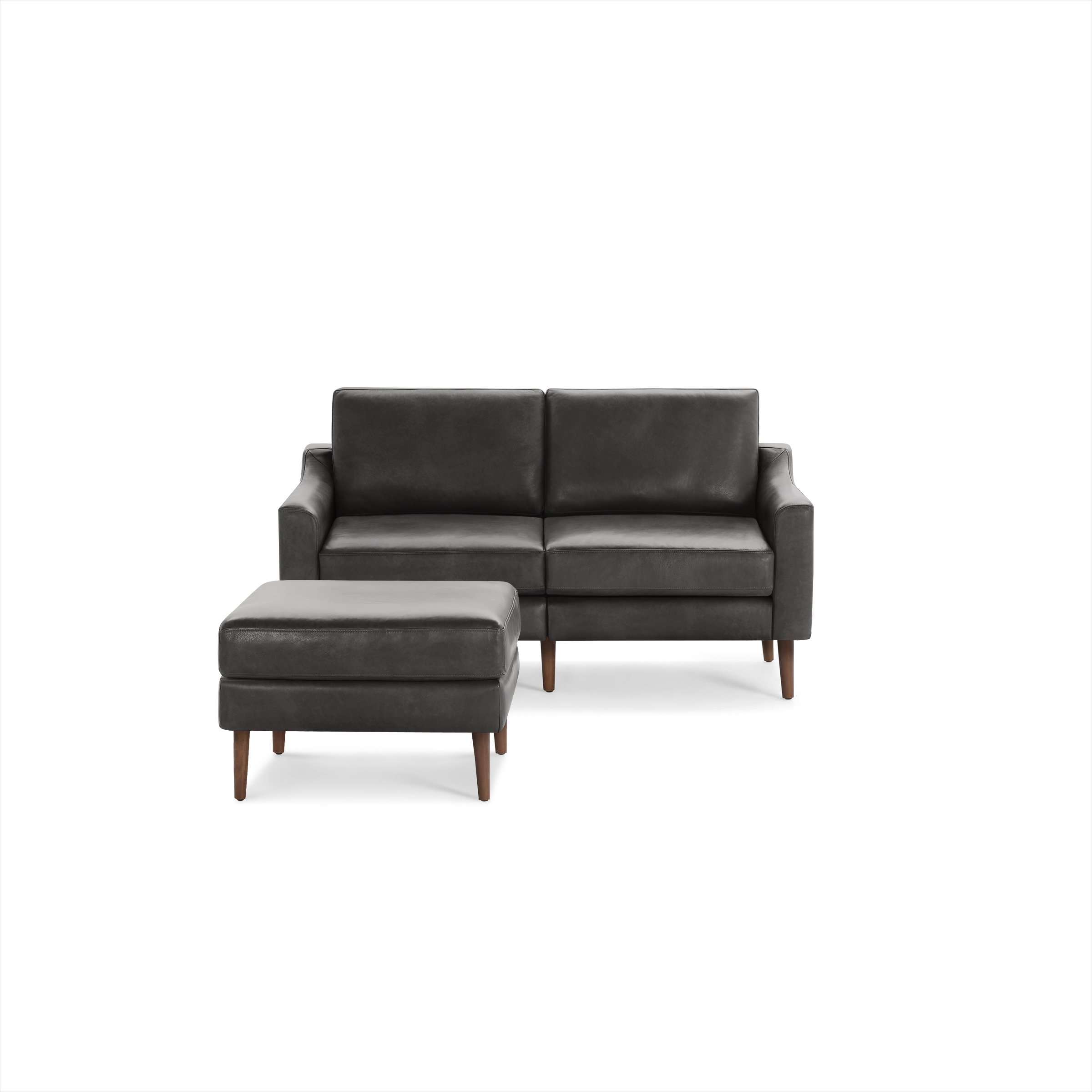 Dark gray leather loveseat sofa with matching ottoman, featuring wooden tapered legs and modern design.