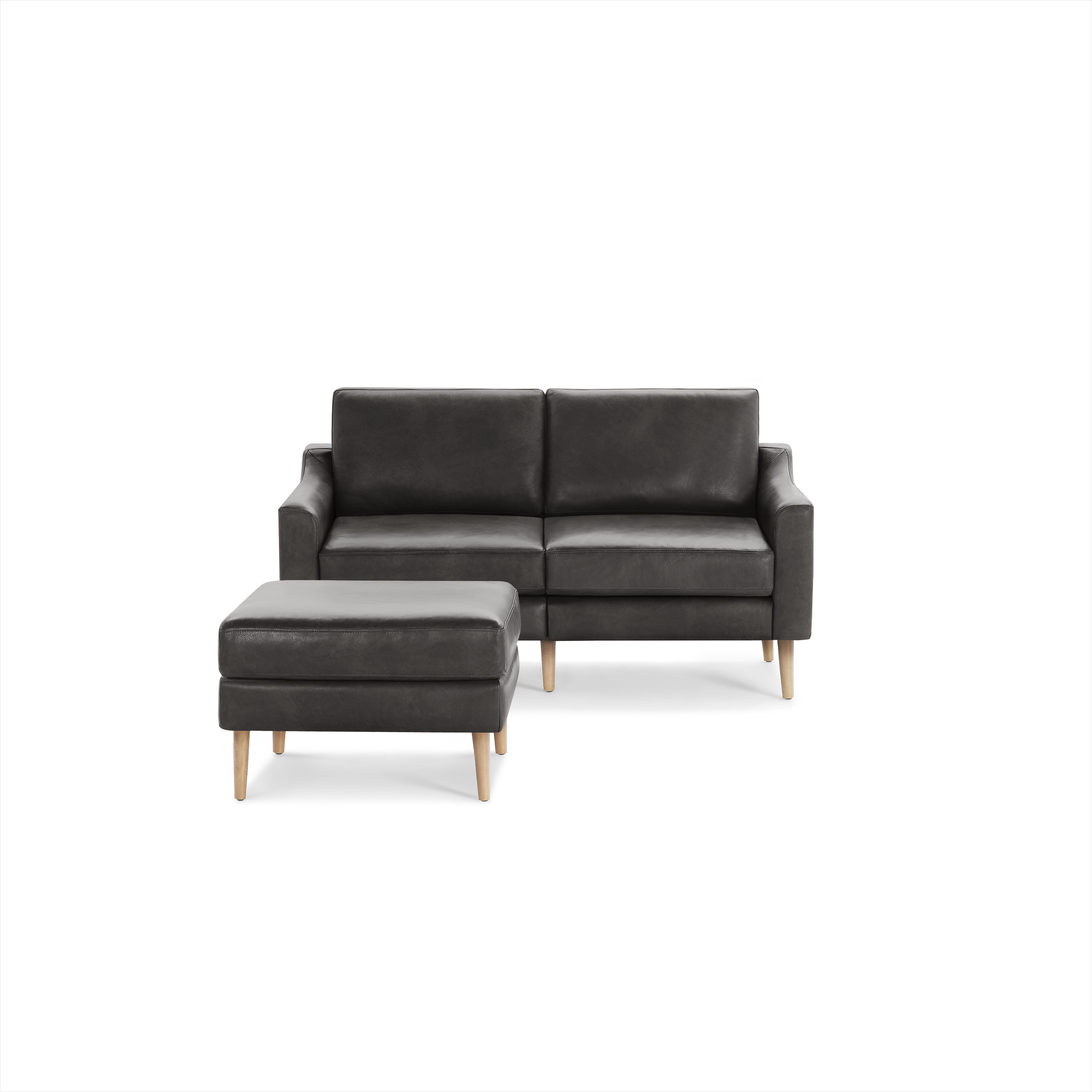Dark gray modern loveseat sofa with matching ottoman, wooden legs, and clean, minimalist design.