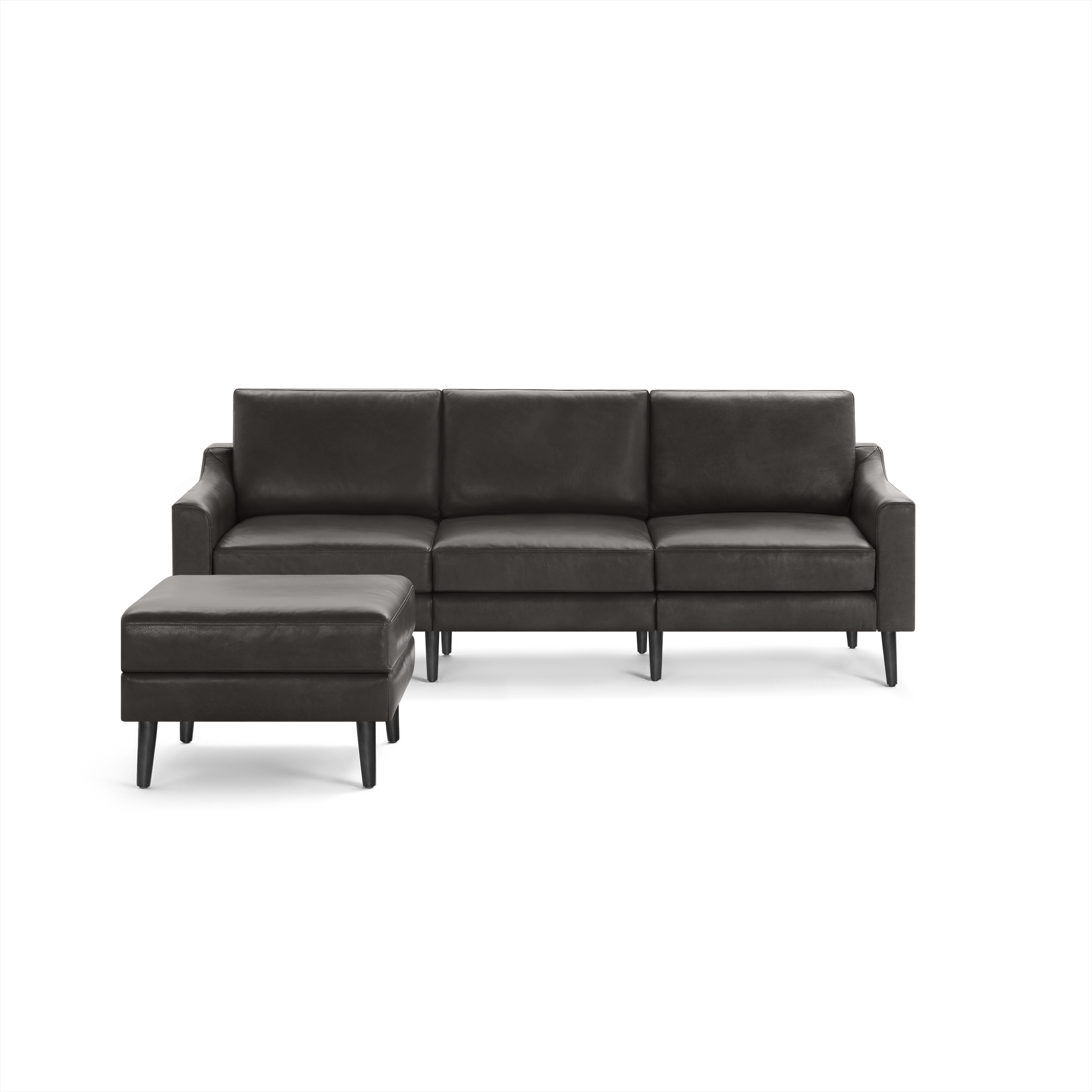 Modern dark brown leather sectional sofa with three seats and matching ottoman on black tapered legs.