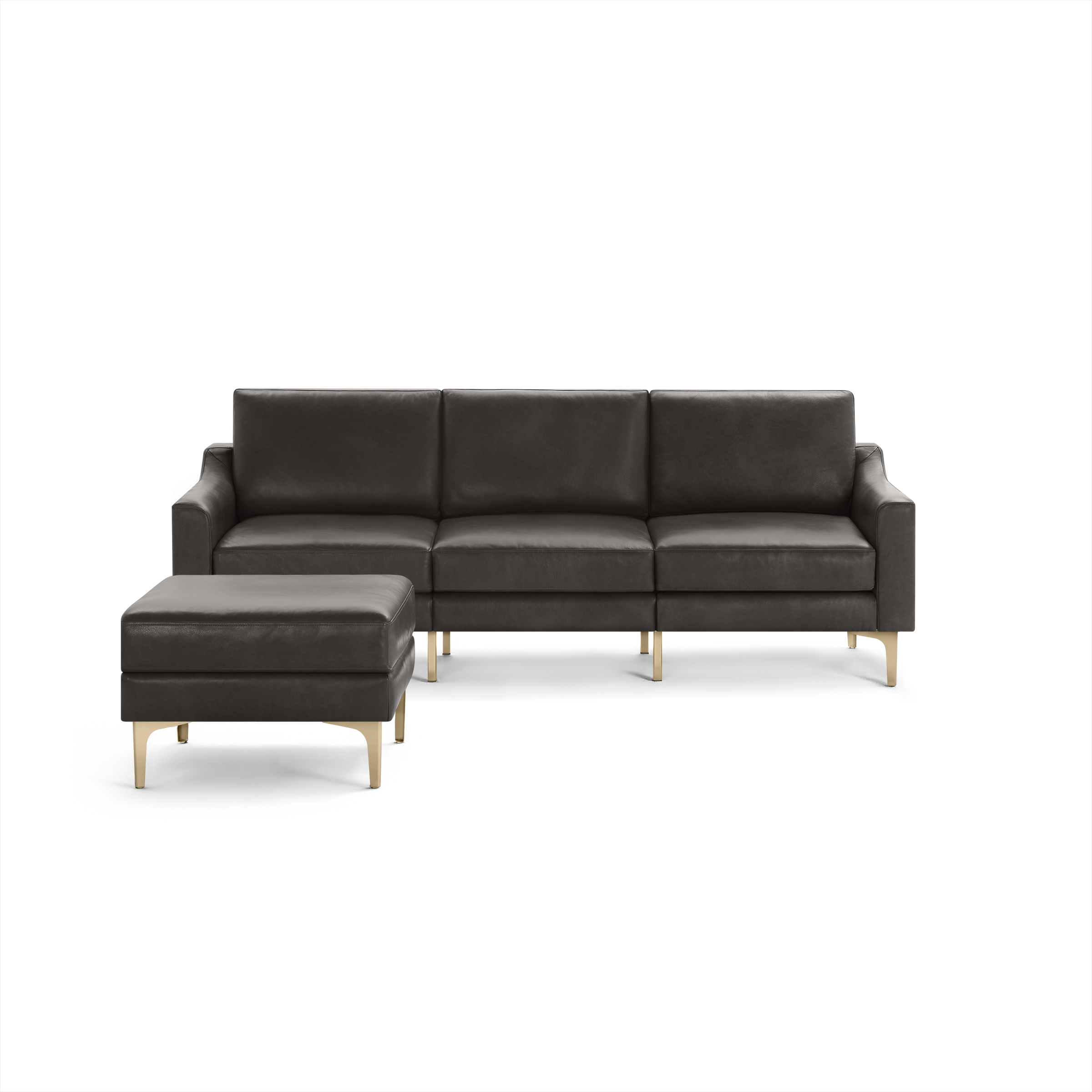 Modern black leather sectional sofa with a matching ottoman, featuring sleek gold metal legs and clean lines.