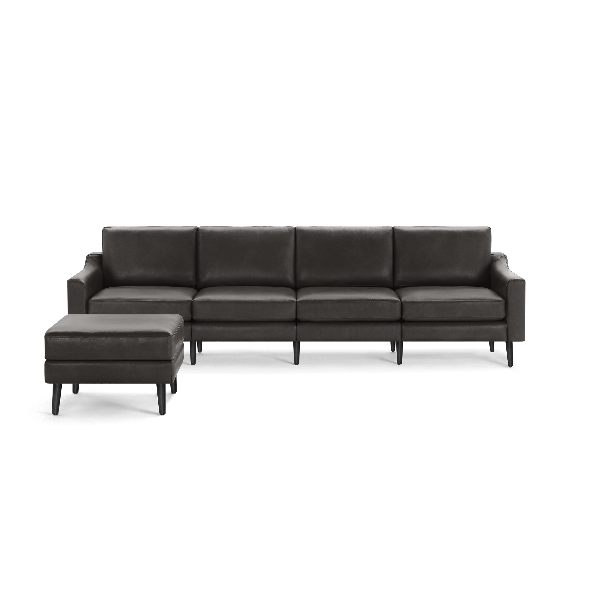 Modern dark gray leather sectional sofa with removable ottoman and wooden legs, designed for spacious comfort and style.