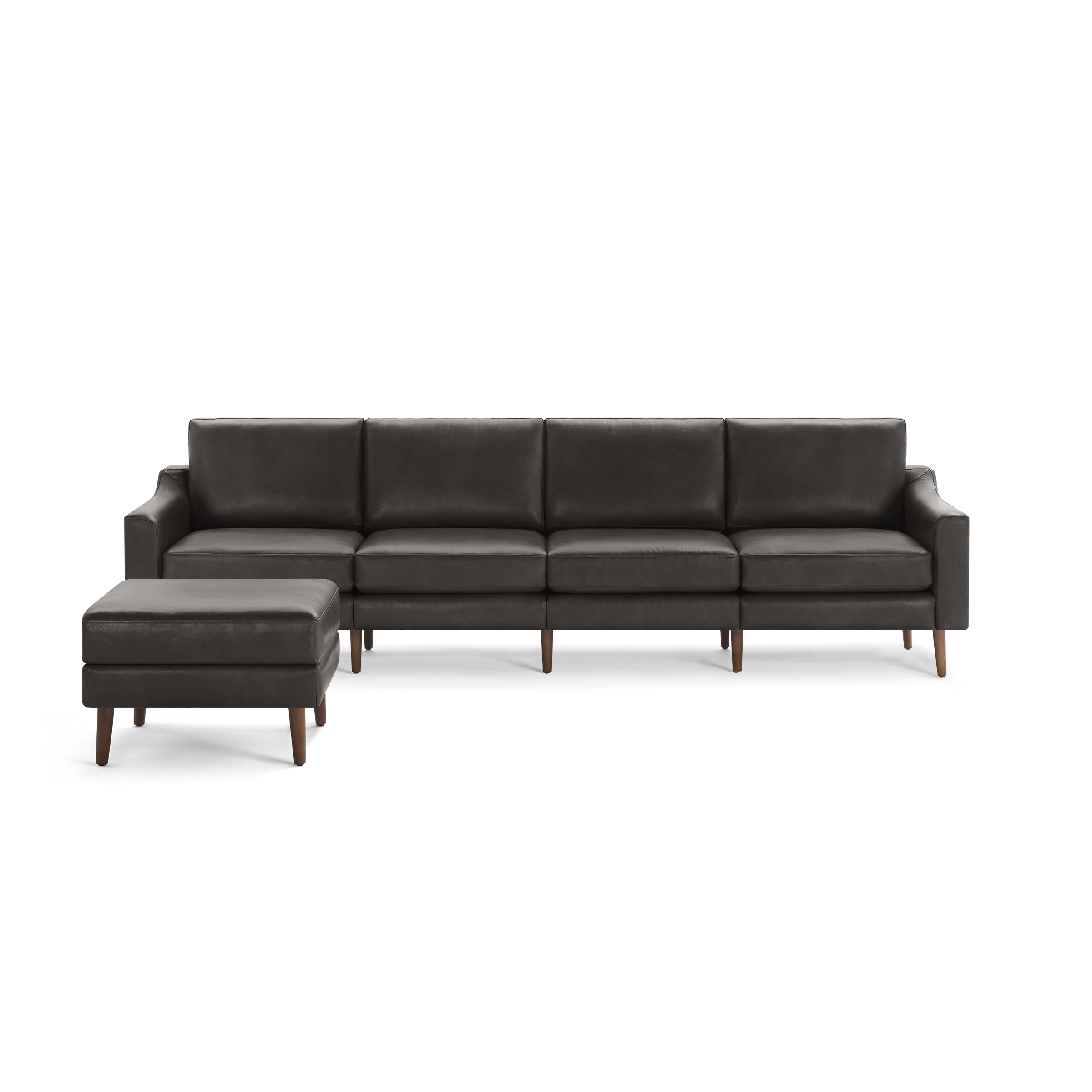 Modern dark gray leather sectional sofa with matching ottoman, clean lines, high back cushions, and wooden tapered legs.