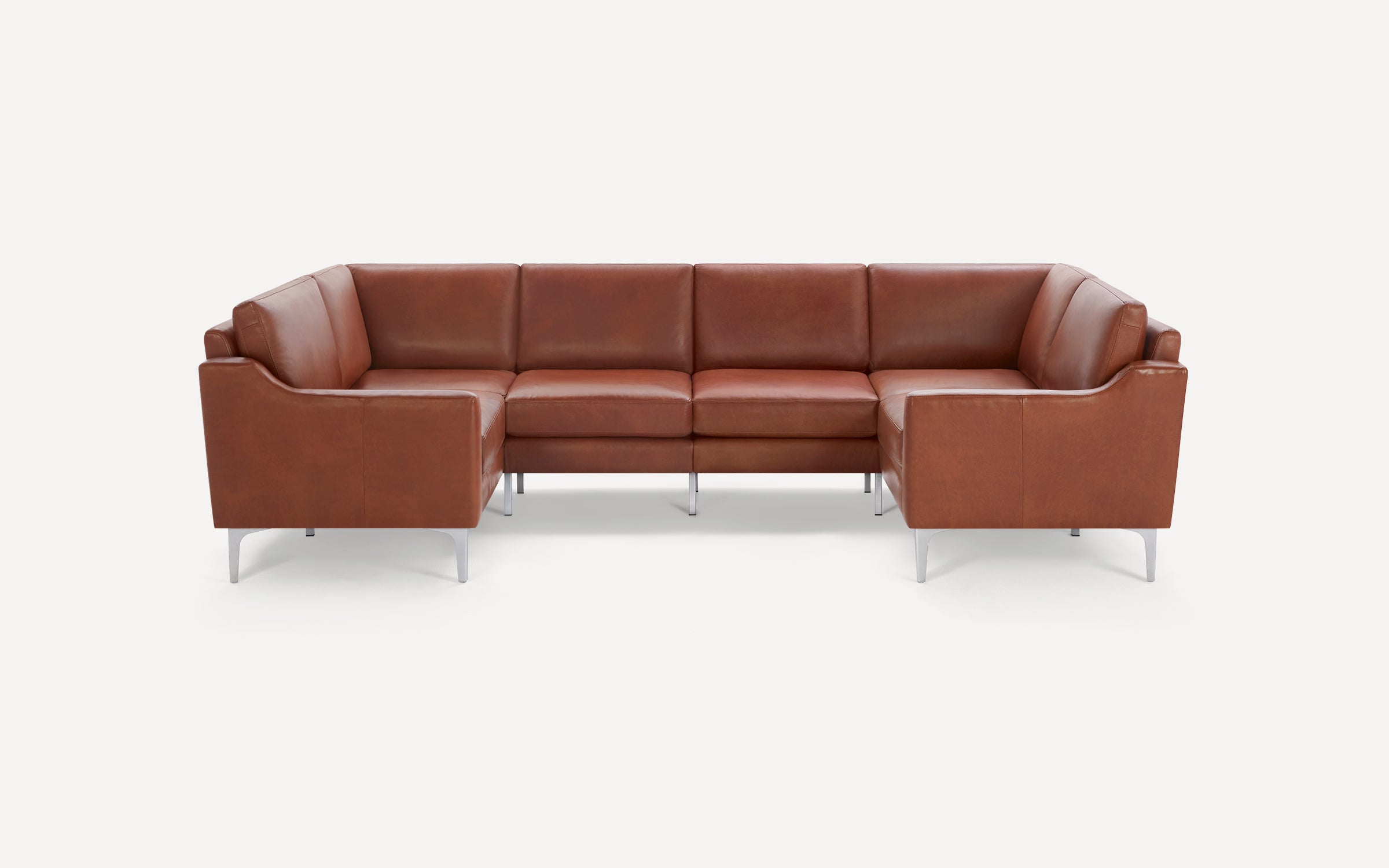 Modern brown leather U-shaped sectional sofa with sleek metal legs on a white background.