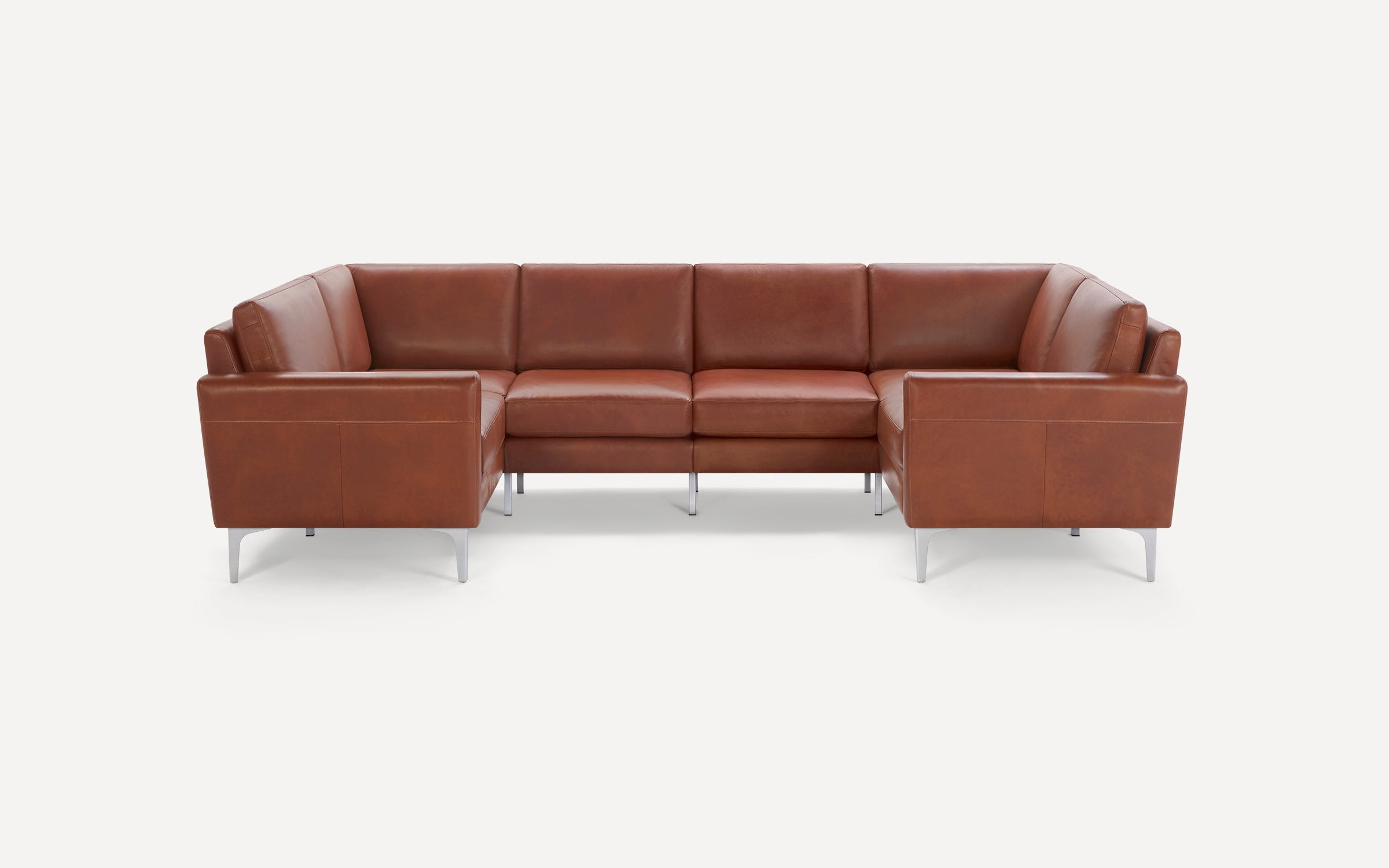 Brown leather sectional sofa with clean lines, metal legs, and plush cushioning, designed for modern living rooms.