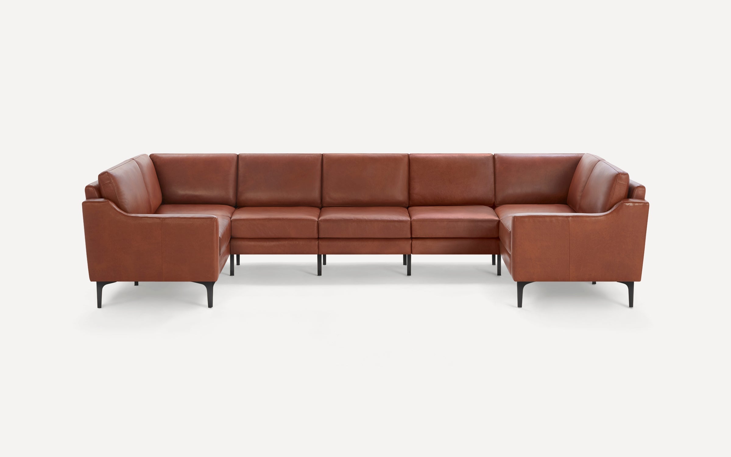 Modern brown leather sectional sofa with clean lines, angled armrests, and slender black metal legs, shown on a white background.