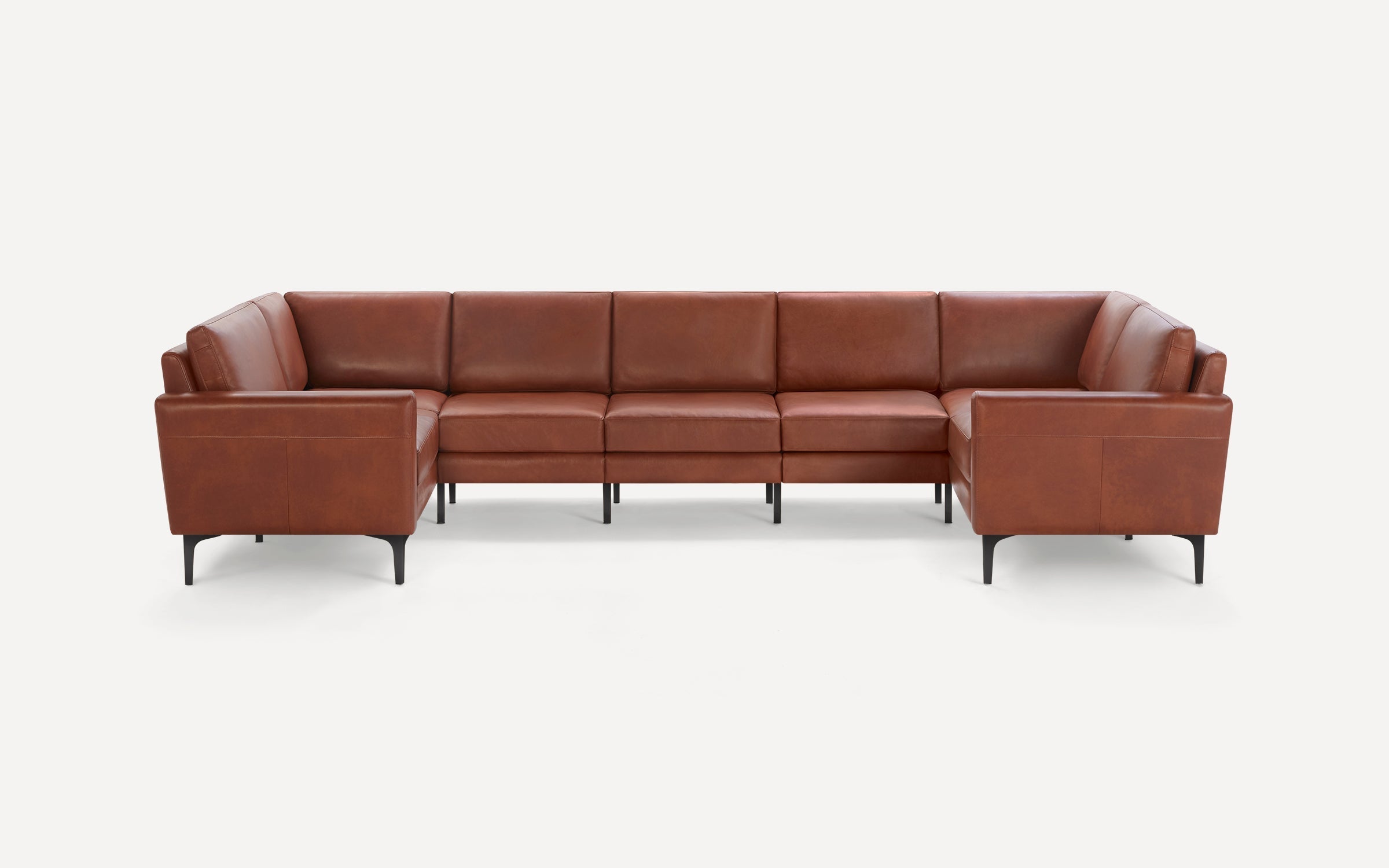 Modern U-shaped sectional sofa upholstered in smooth brown leather with slim black metal legs and clean lines.