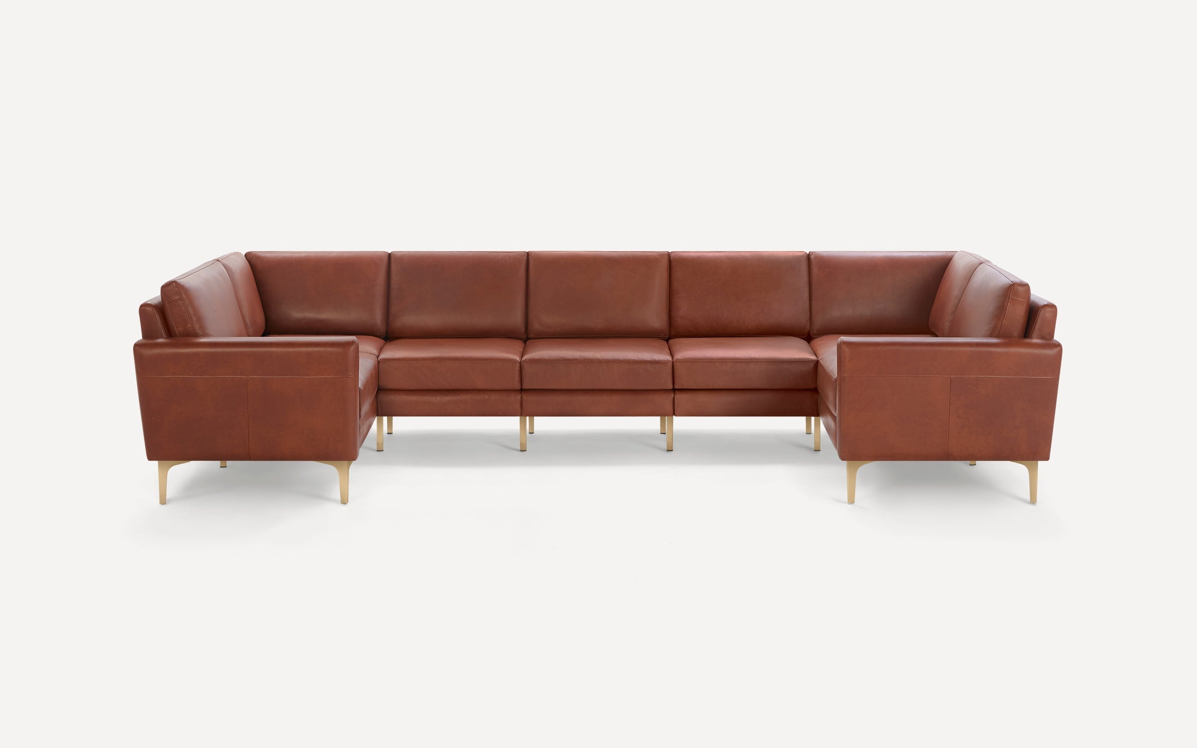 Contemporary U-shaped sectional sofa in rich brown leather with cushioned seats, backs, and slim gold metal legs.