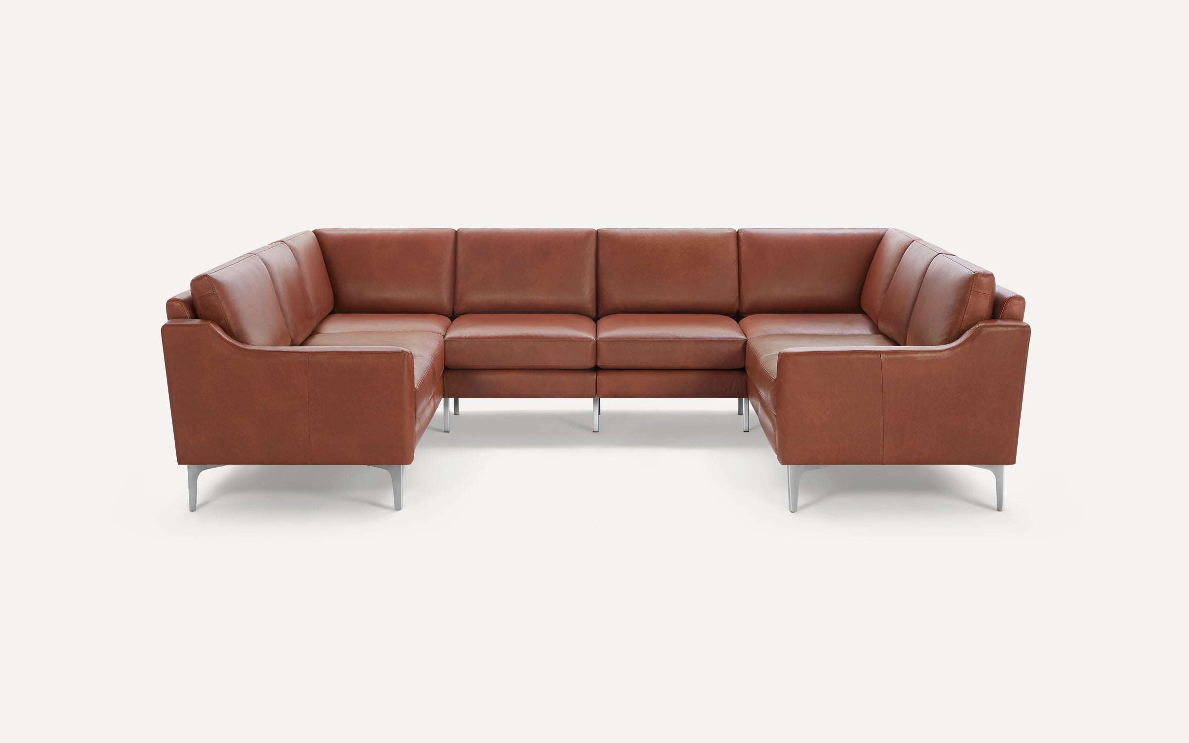 Large U-shaped sectional sofa with brown leather upholstery and sleek silver metal legs on a white background.