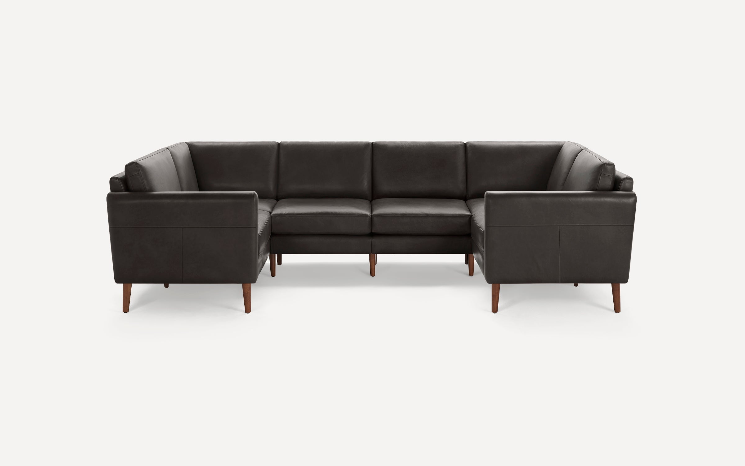 Dark brown leather U-shaped sectional sofa with clean lines and wooden tapered legs on a white background.
