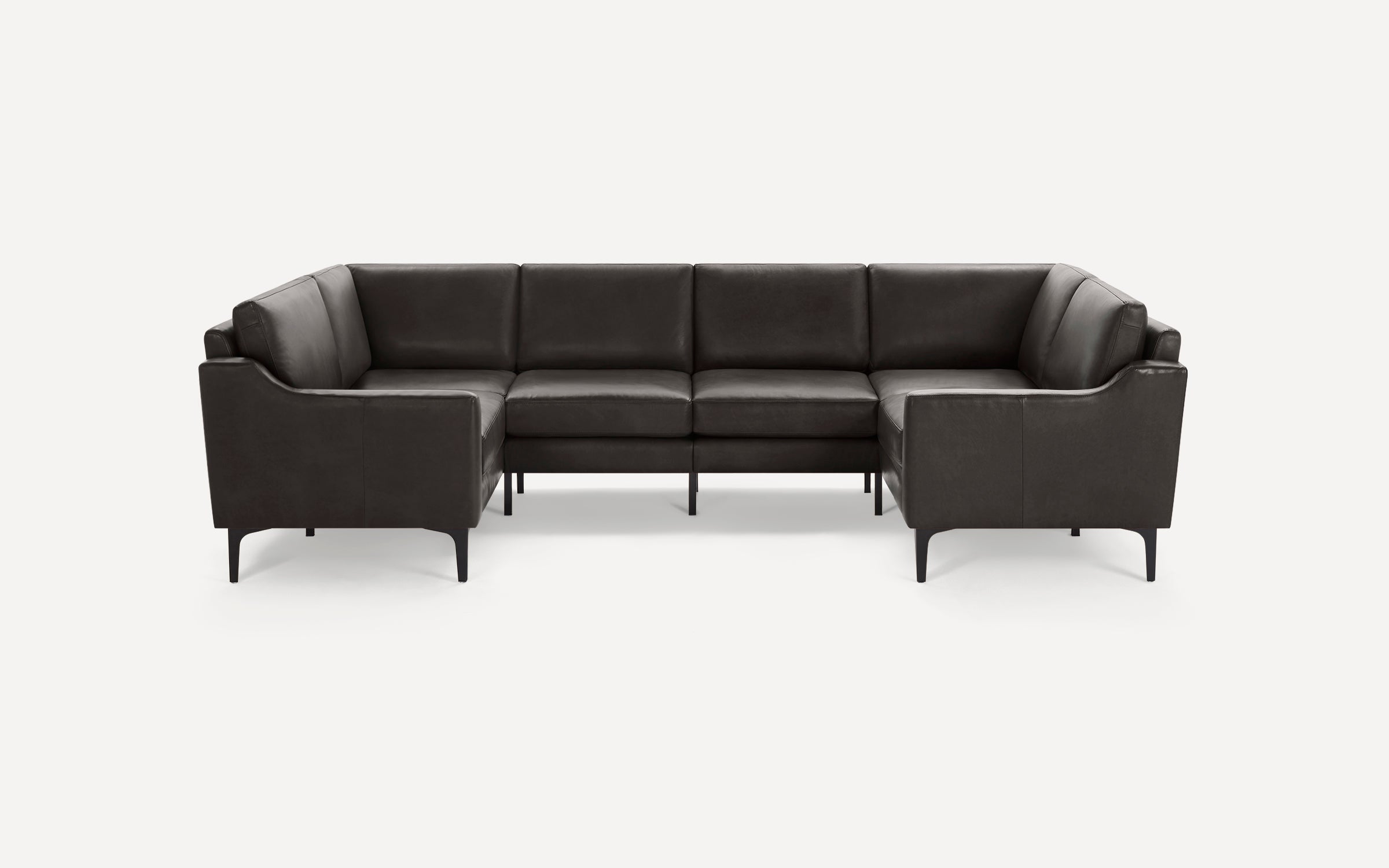 Modern dark gray leather sectional sofa with clean lines and slim black metal legs, arranged in a U-shape.