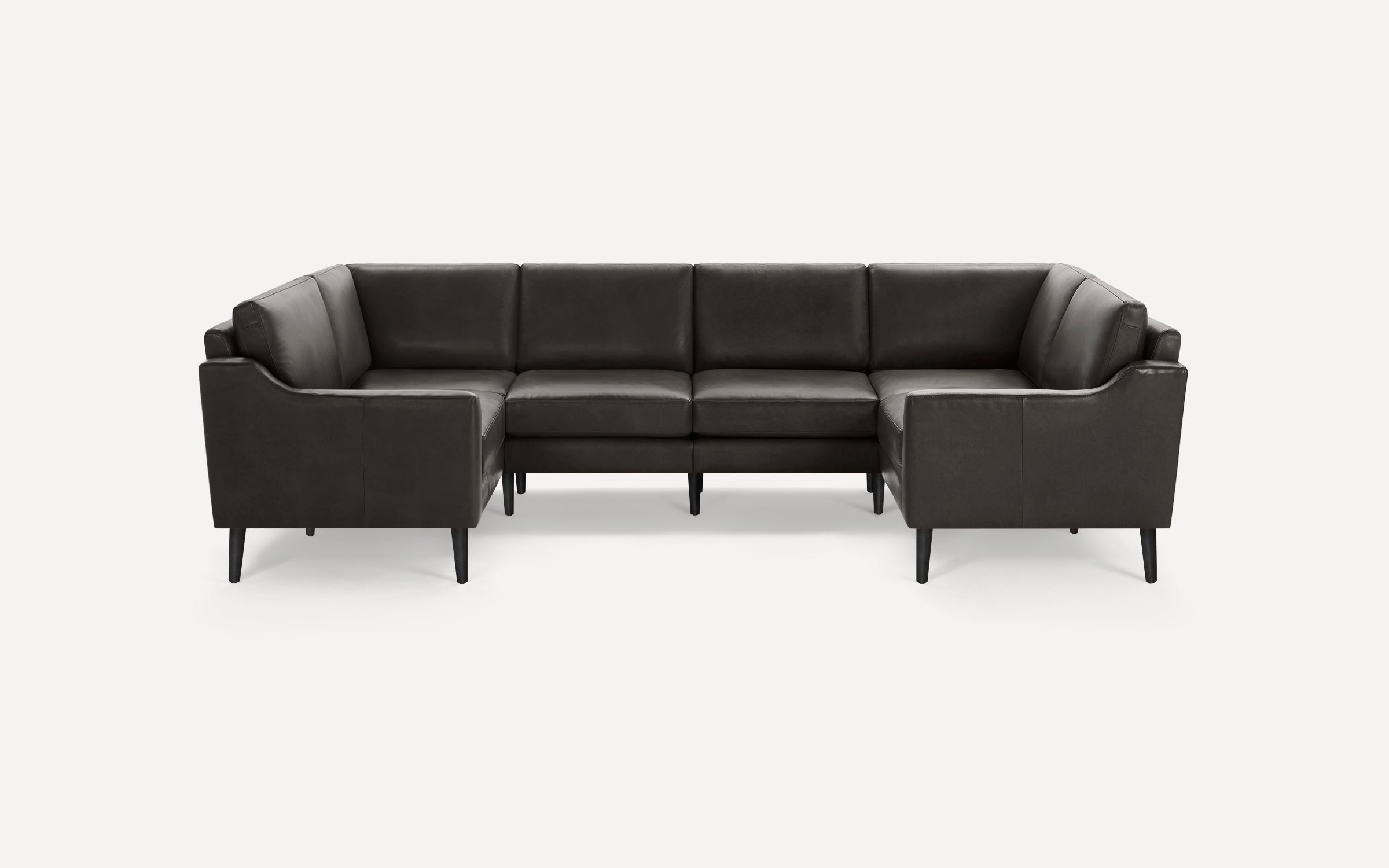 Dark brown leather U-shaped sectional sofa with clean lines and slim black tapered legs on plain white background.