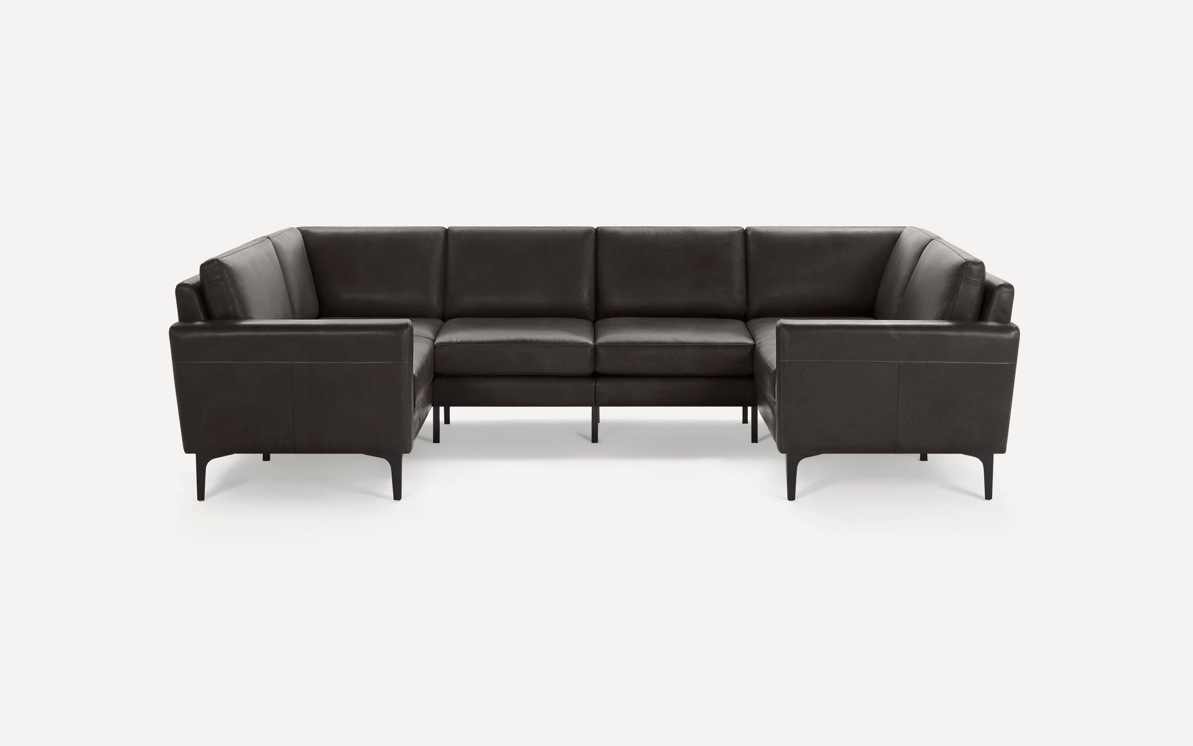 Modern U-shaped sectional sofa with dark brown leather upholstery and slender black metal legs against white background.