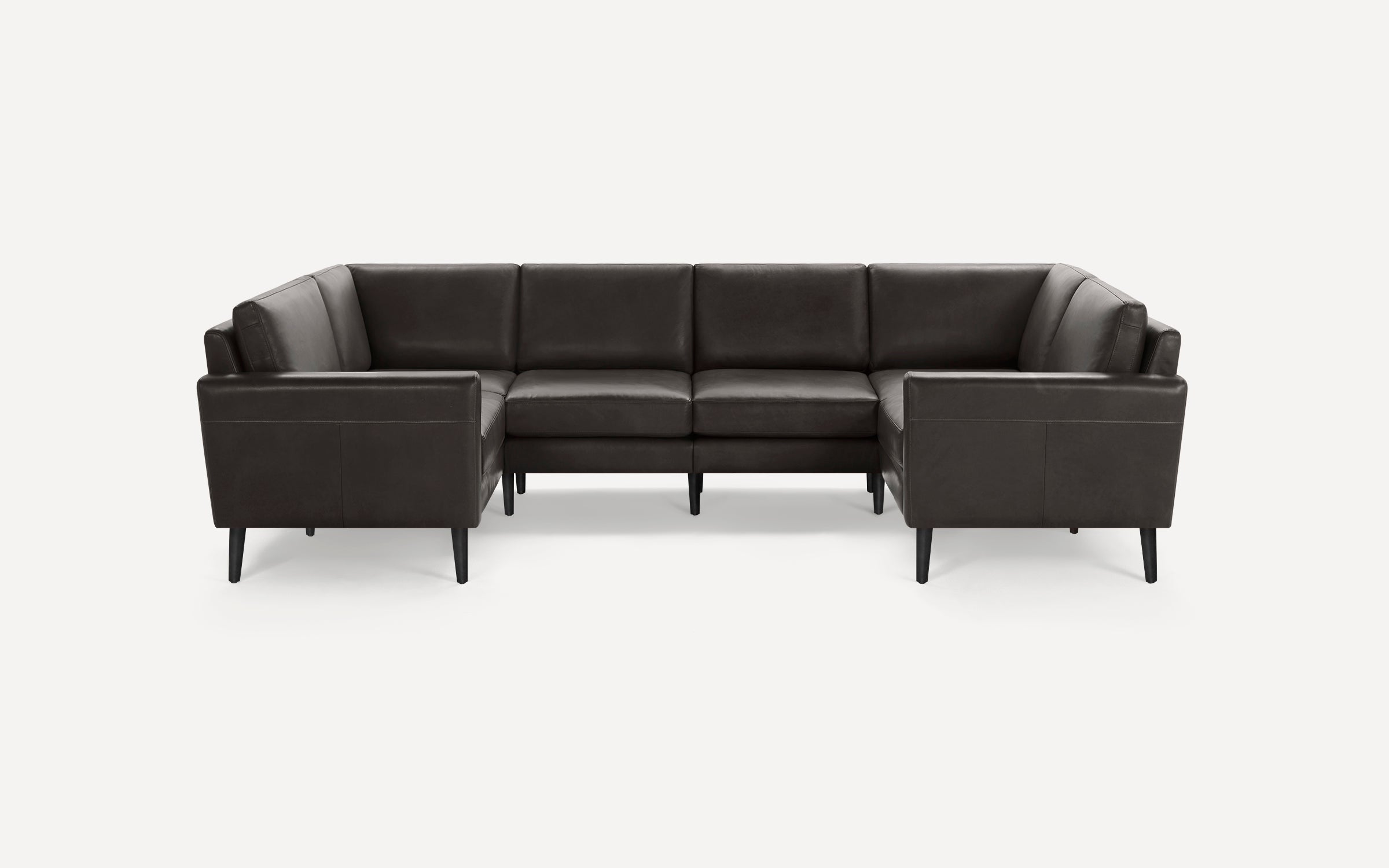 Dark brown leather U-shaped sectional sofa with clean lines and tapered black wooden legs on a white background.