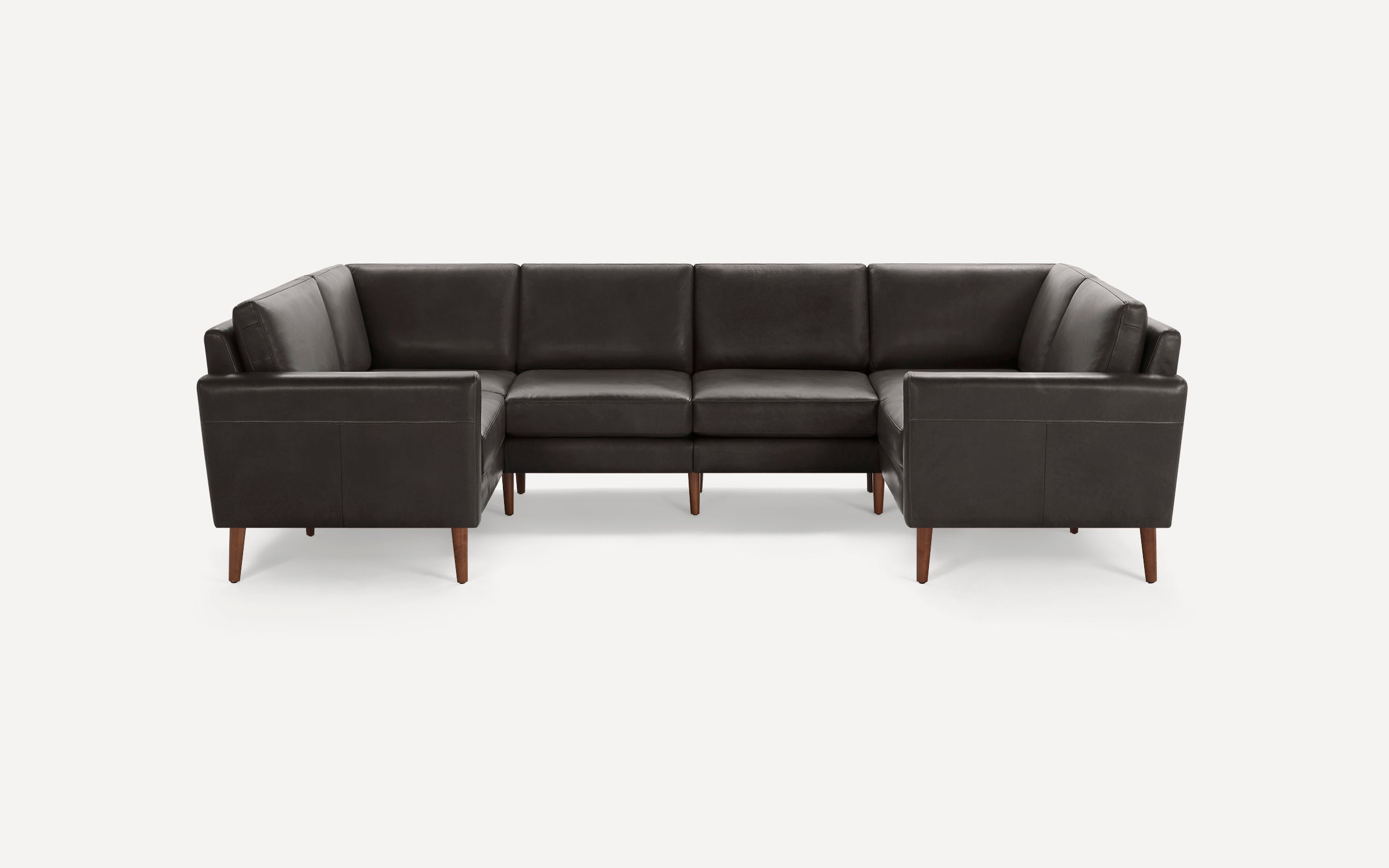 Modern dark gray leather U-shaped sectional sofa with wooden legs and straight armrests, designed for spacious seating.