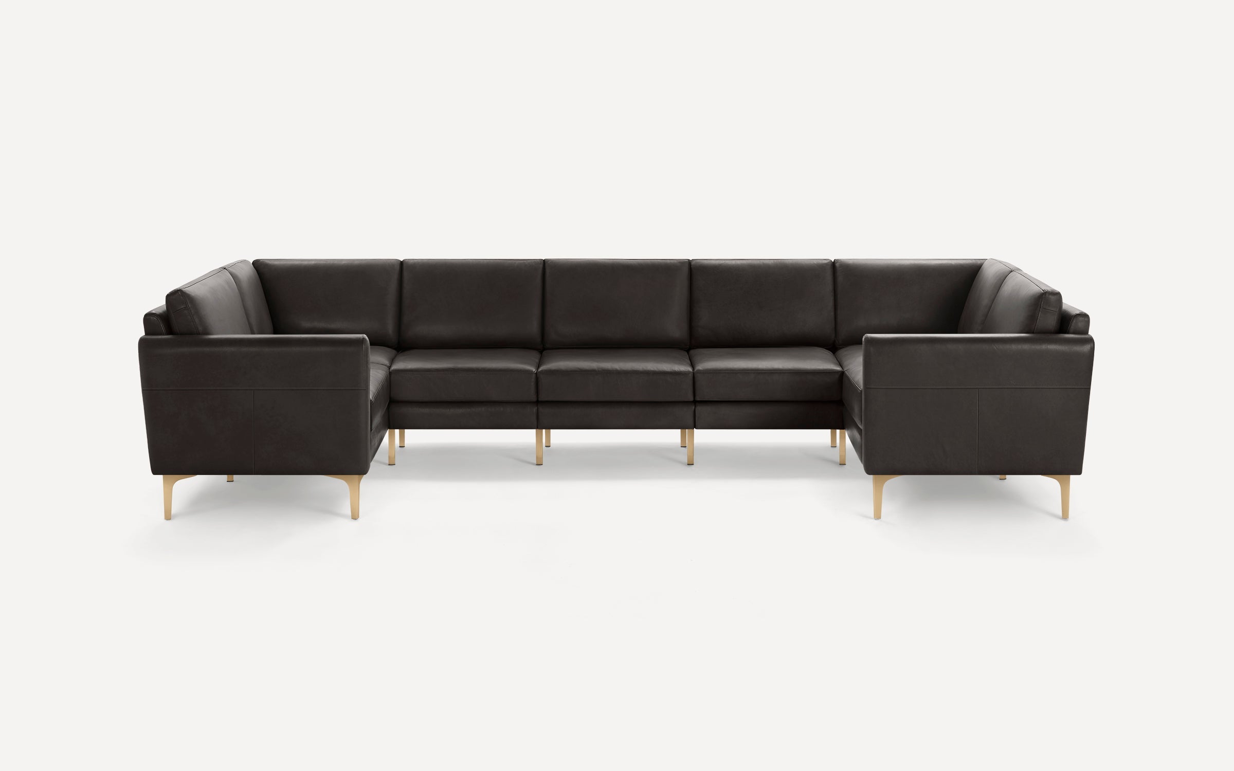 Large dark brown leather sectional sofa with clean lines and slim gold metal legs on a white background.