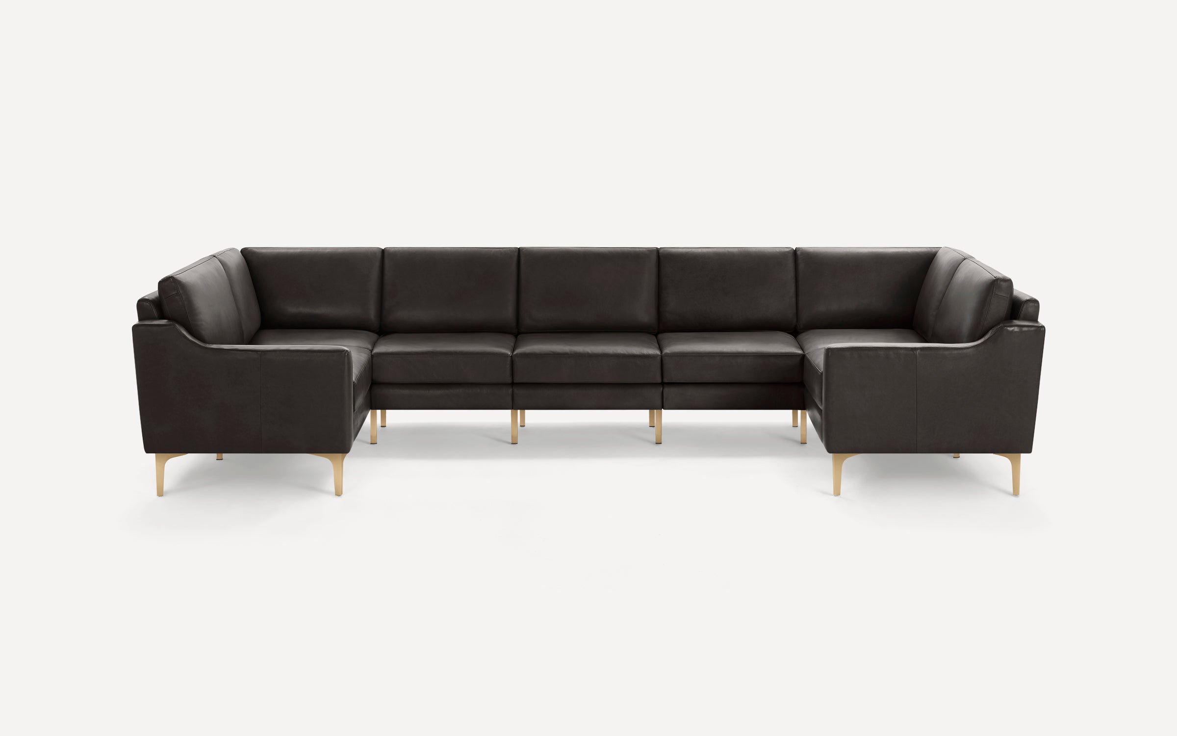 Modern dark brown leather sectional sofa with gold metal legs, featuring clean lines and cushioned seats.