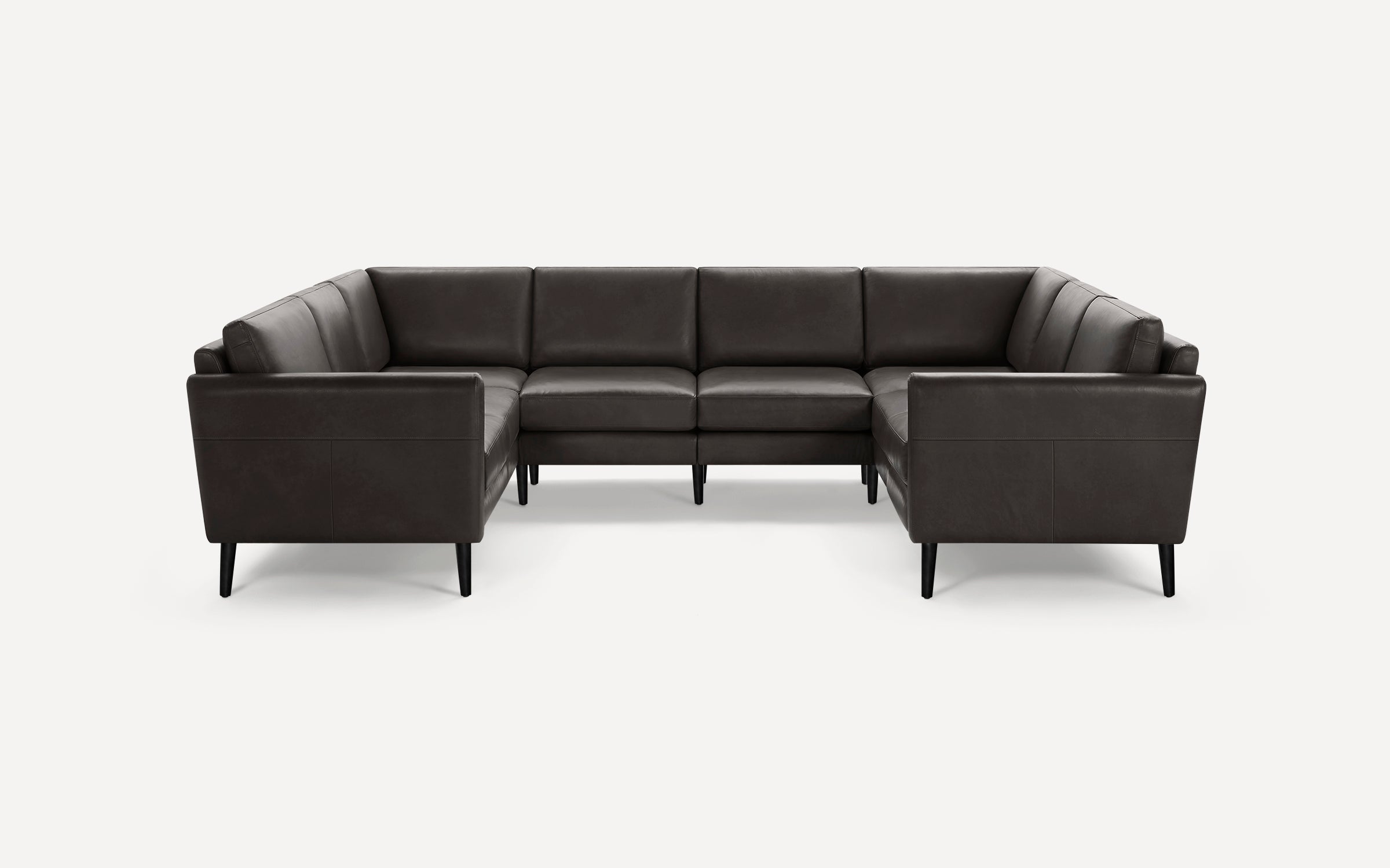 Dark brown leather U-shaped sectional sofa with clean lines and black tapered legs against a white background.