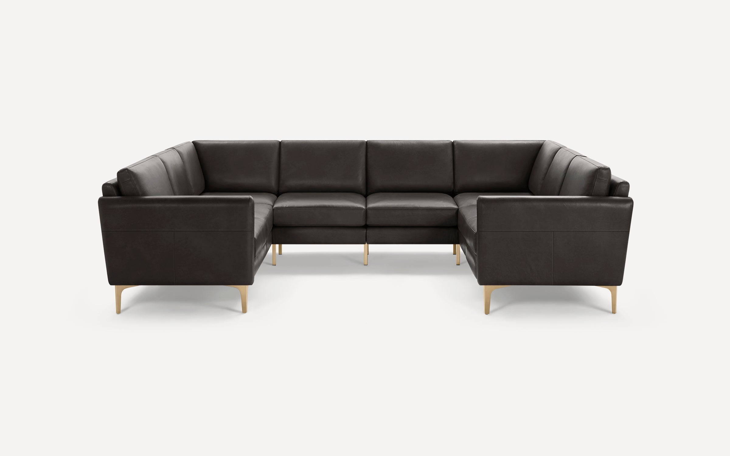 Modern dark brown leather sectional sofa with gold metal legs, clean lines, and cushioned seating.