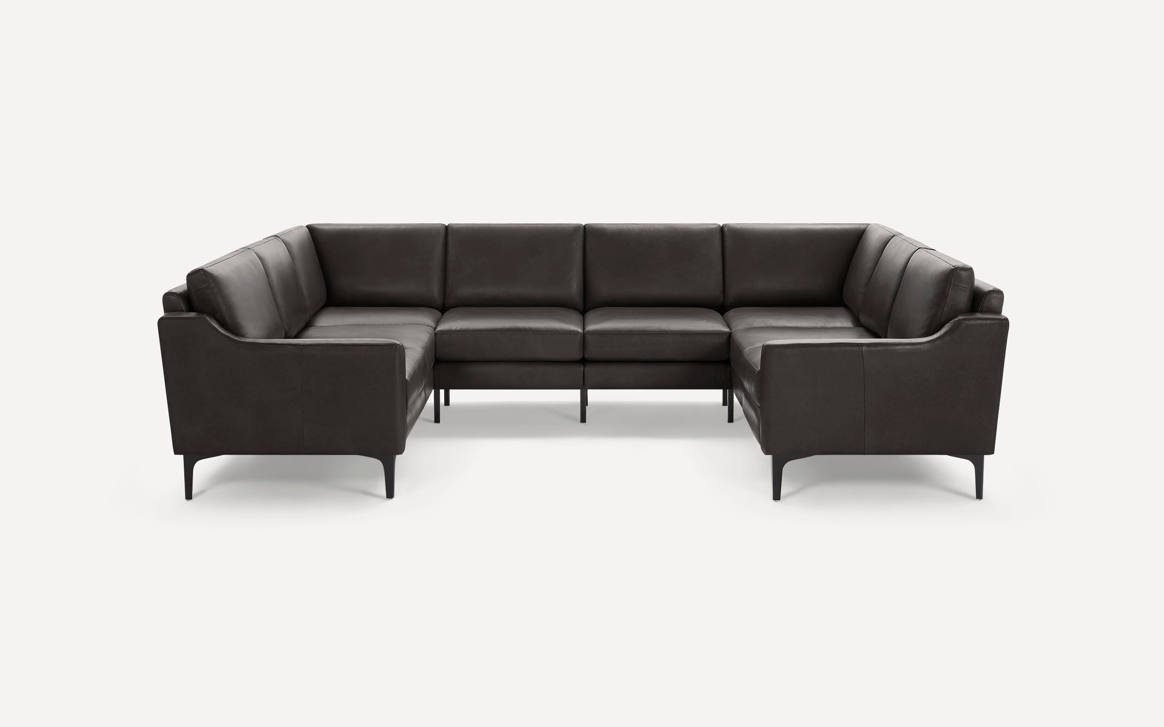 Dark brown leather U-shaped sectional sofa with sleek, modern design and slender black metal legs.
